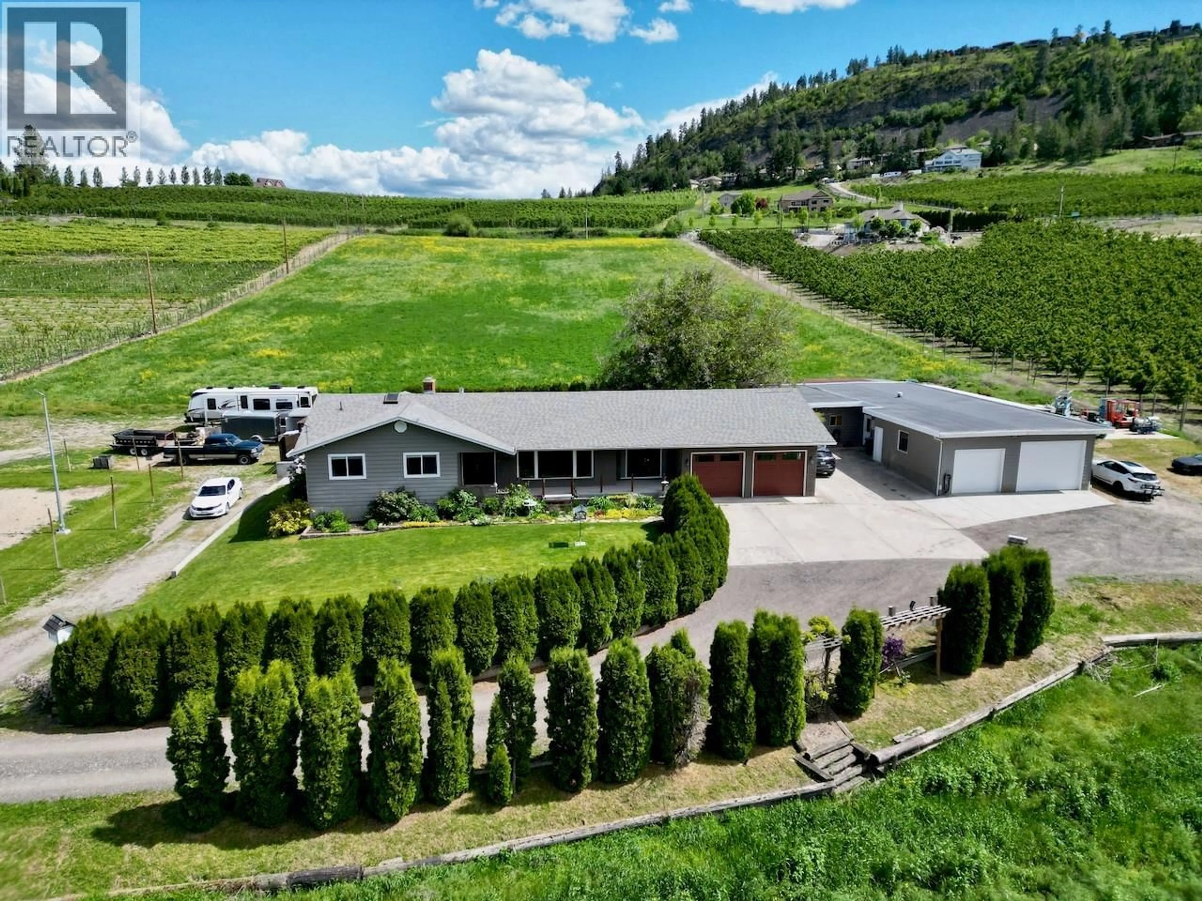 A pic from outside/outdoor area/front of a property/back of a property/a pic from drone, mountain view for 1-3 - 371 VALLEY ROAD, Kelowna British Columbia V1V2E5