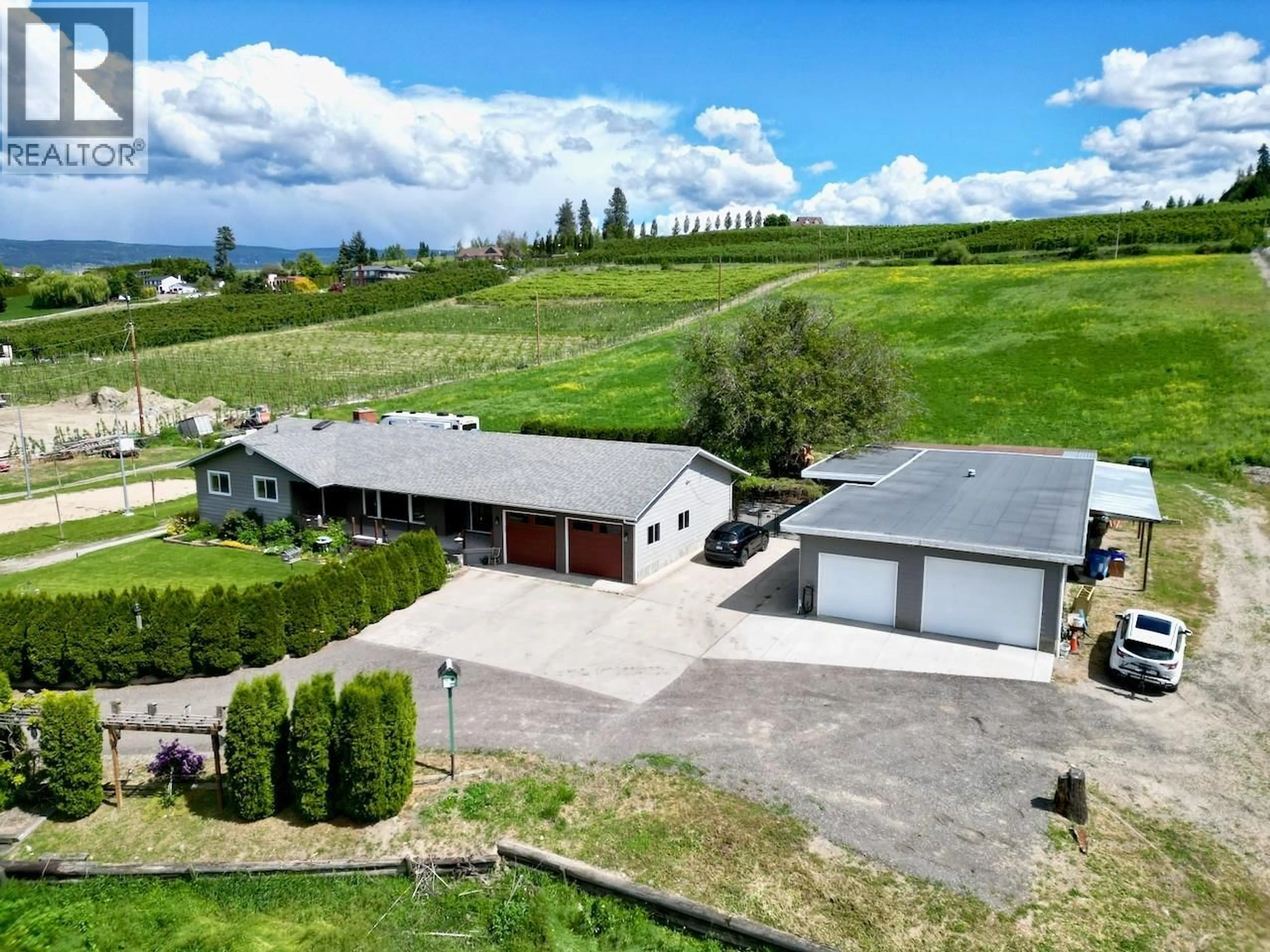 A pic from outside/outdoor area/front of a property/back of a property/a pic from drone, mountain view for 1-3 - 371 VALLEY ROAD, Kelowna British Columbia V1V2E5