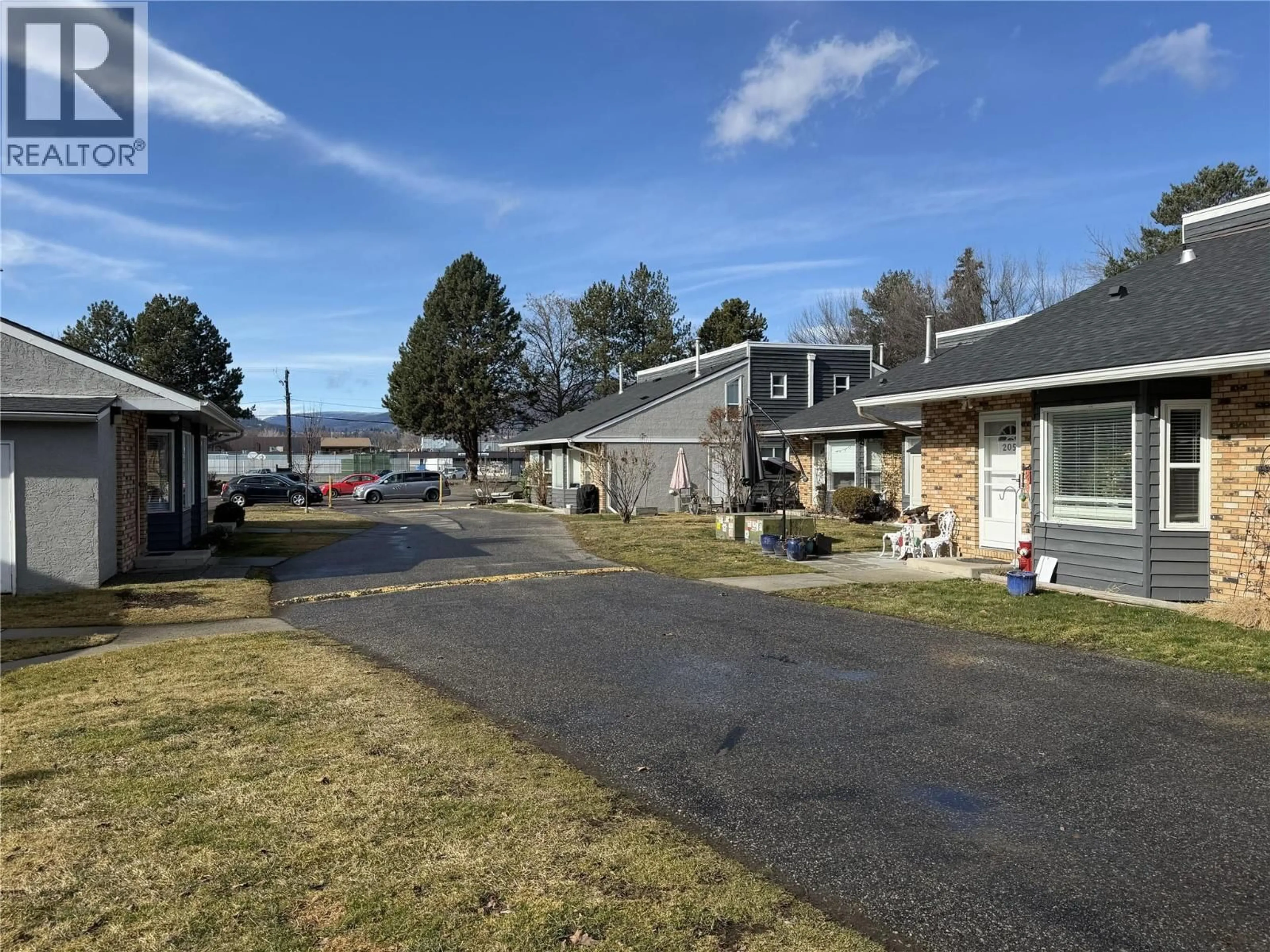 A pic from outside/outdoor area/front of a property/back of a property/a pic from drone, street for 207 - 3155 GORDON DRIVE, Kelowna British Columbia V1W3N5