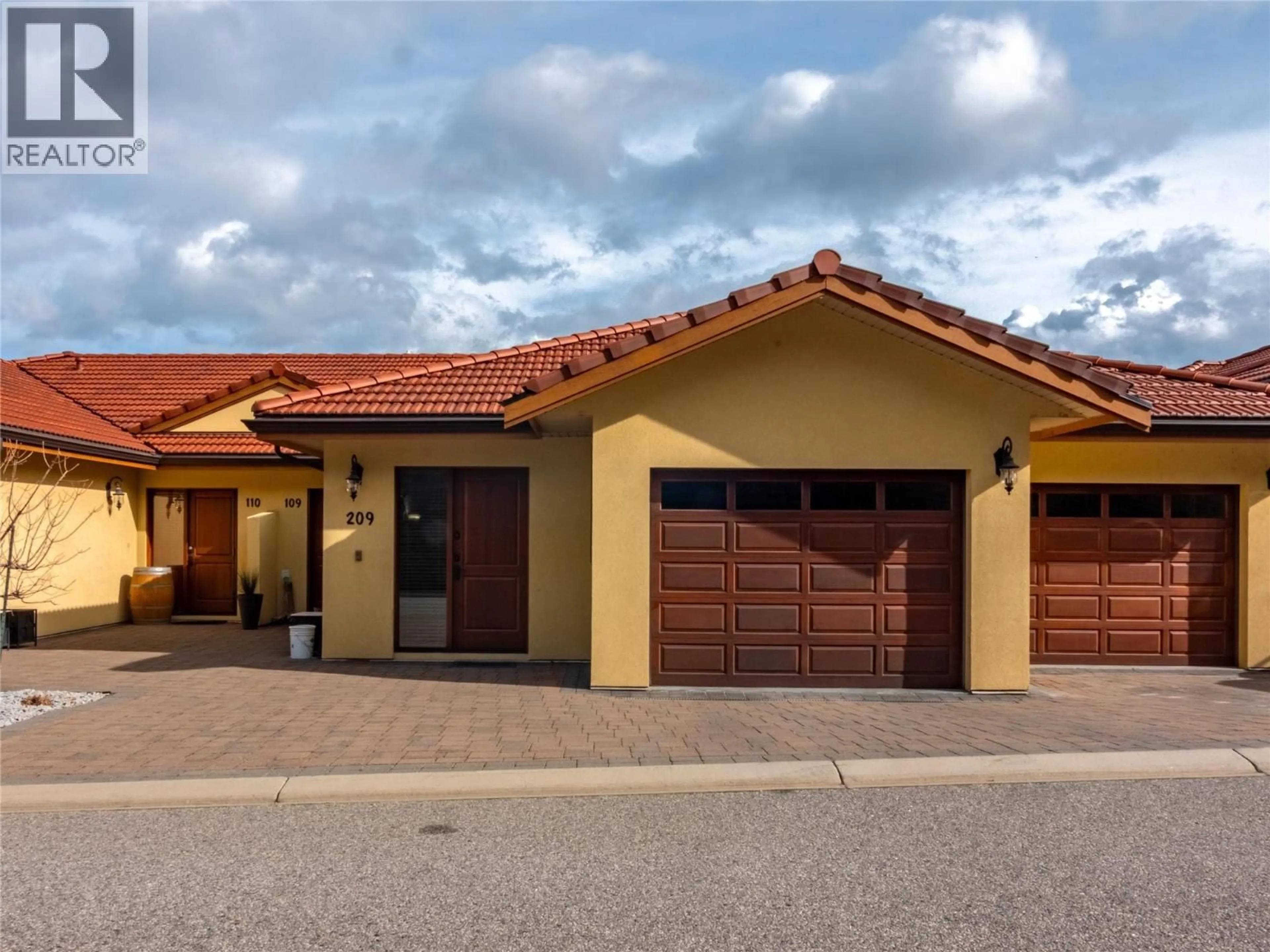 Home with brick exterior material, street for 209 - 14419 DOWNTON AVENUE, Summerland British Columbia V0H1Z1