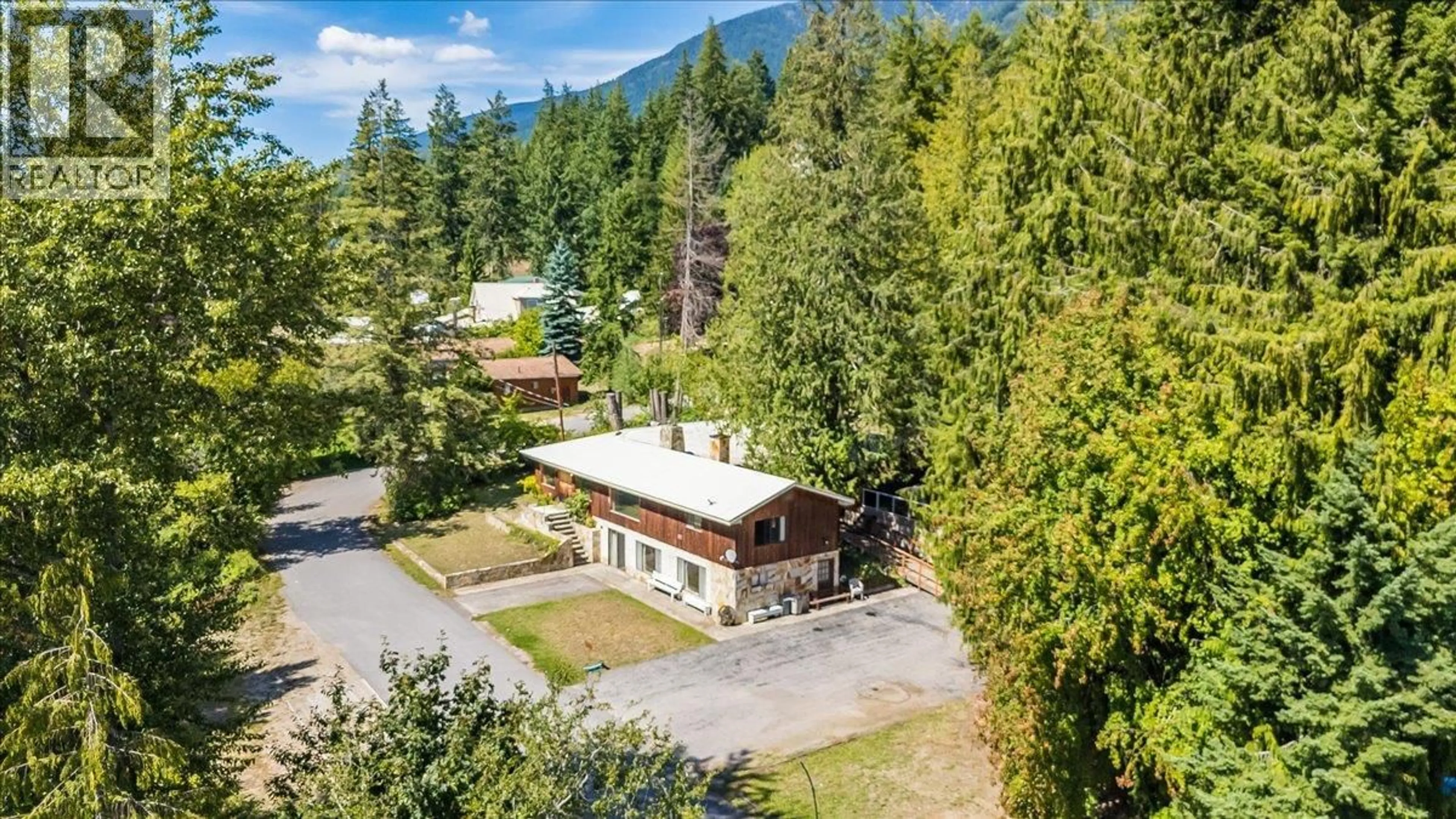 A pic from outside/outdoor area/front of a property/back of a property/a pic from drone, mountain view for 7691 BALFOUR WHARF ROAD, Balfour British Columbia V0G1C0