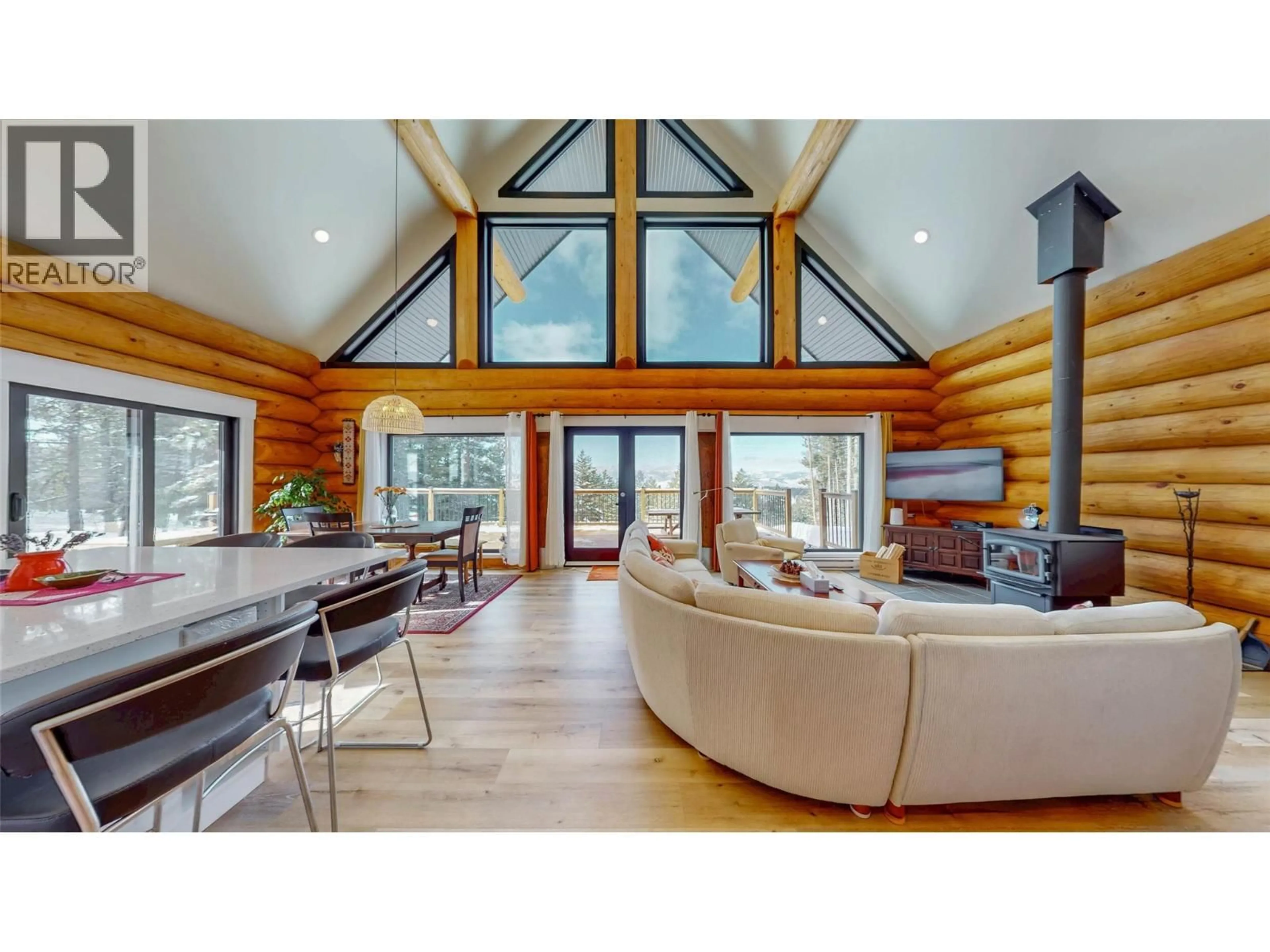 Living room with furniture, wood/laminate floor for 185 CARIBOU WAY, Osoyoos British Columbia V0H1V6