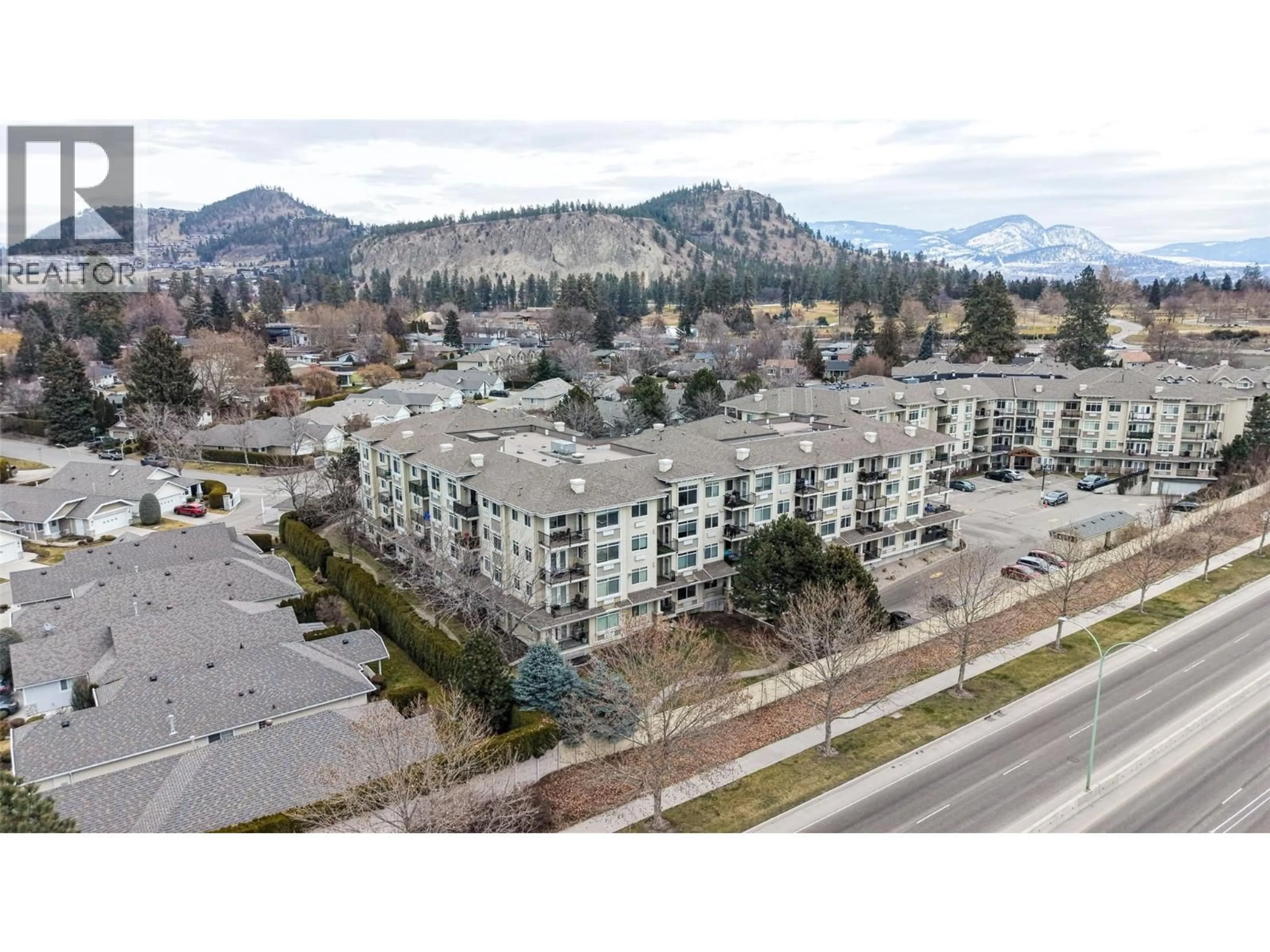 A pic from outside/outdoor area/front of a property/back of a property/a pic from drone, mountain view for 211 - 1350 RIDGEWAY DRIVE, Kelowna British Columbia V1Y9T8