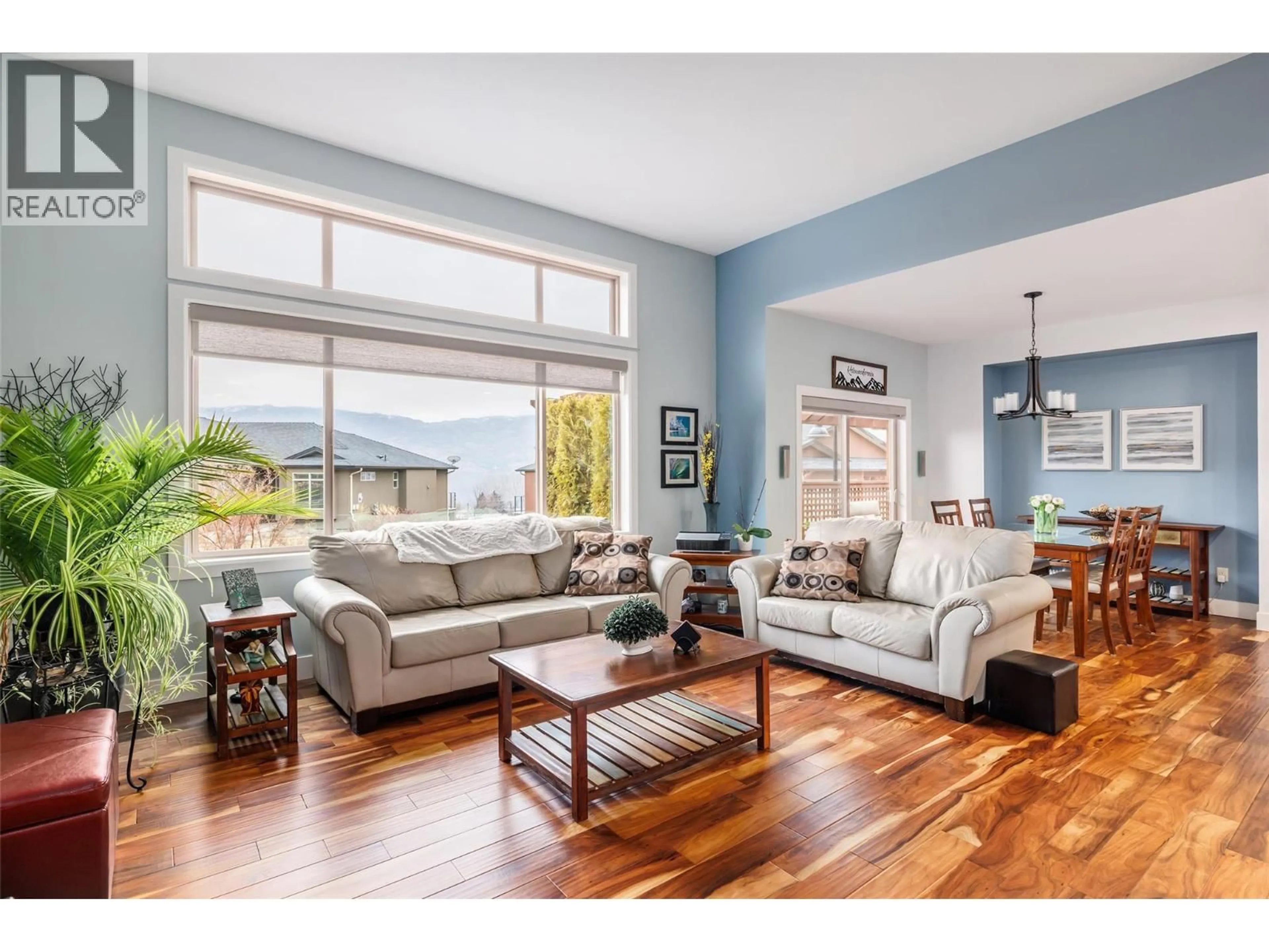 Living room with furniture, wood/laminate floor for 2150 TALAVERA PLACE, West Kelowna British Columbia V4T3H8