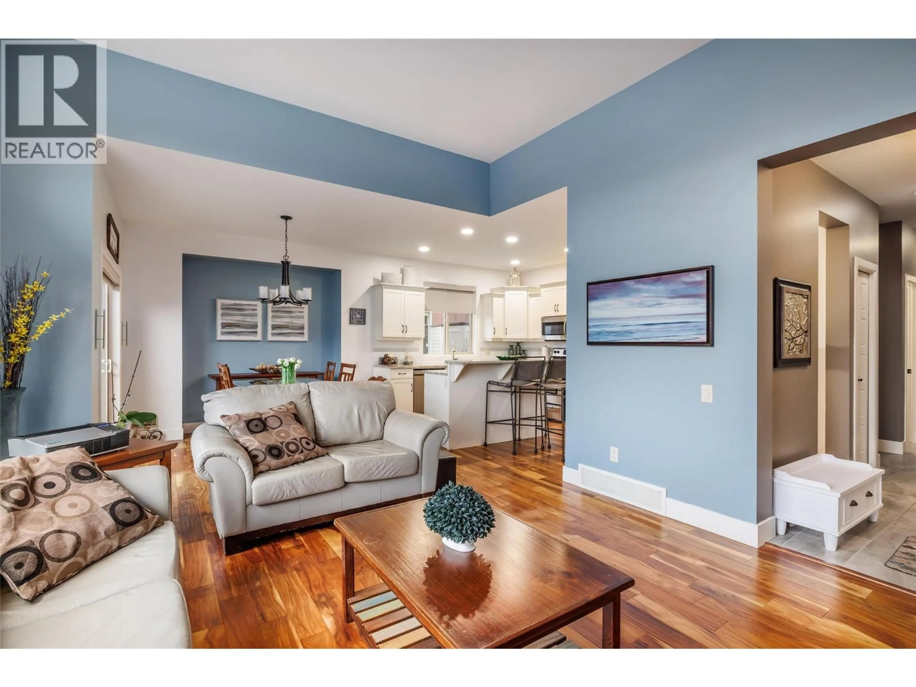 Living room with furniture, wood/laminate floor for 2150 TALAVERA PLACE, West Kelowna British Columbia V4T3H8