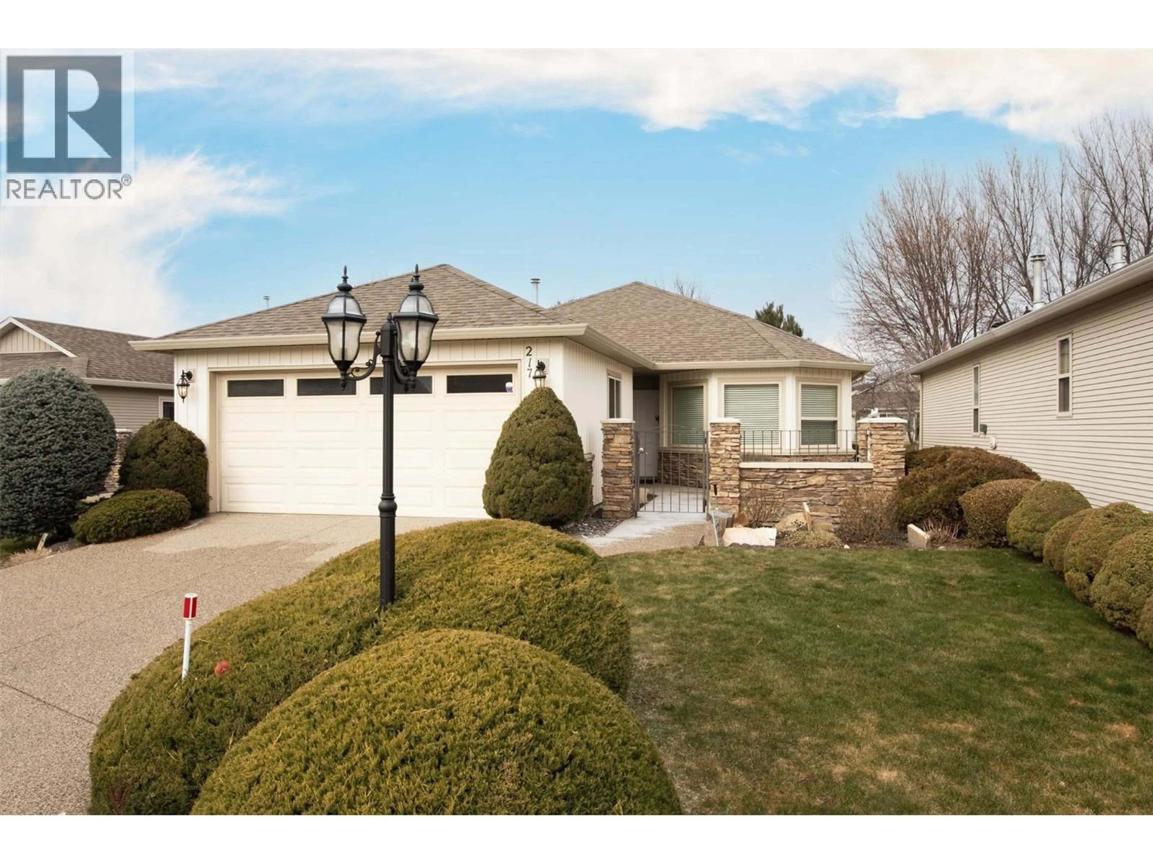 Home with vinyl exterior material, street for 217 - 2365 STILLINGFLEET ROAD, Kelowna British Columbia V1W3X9