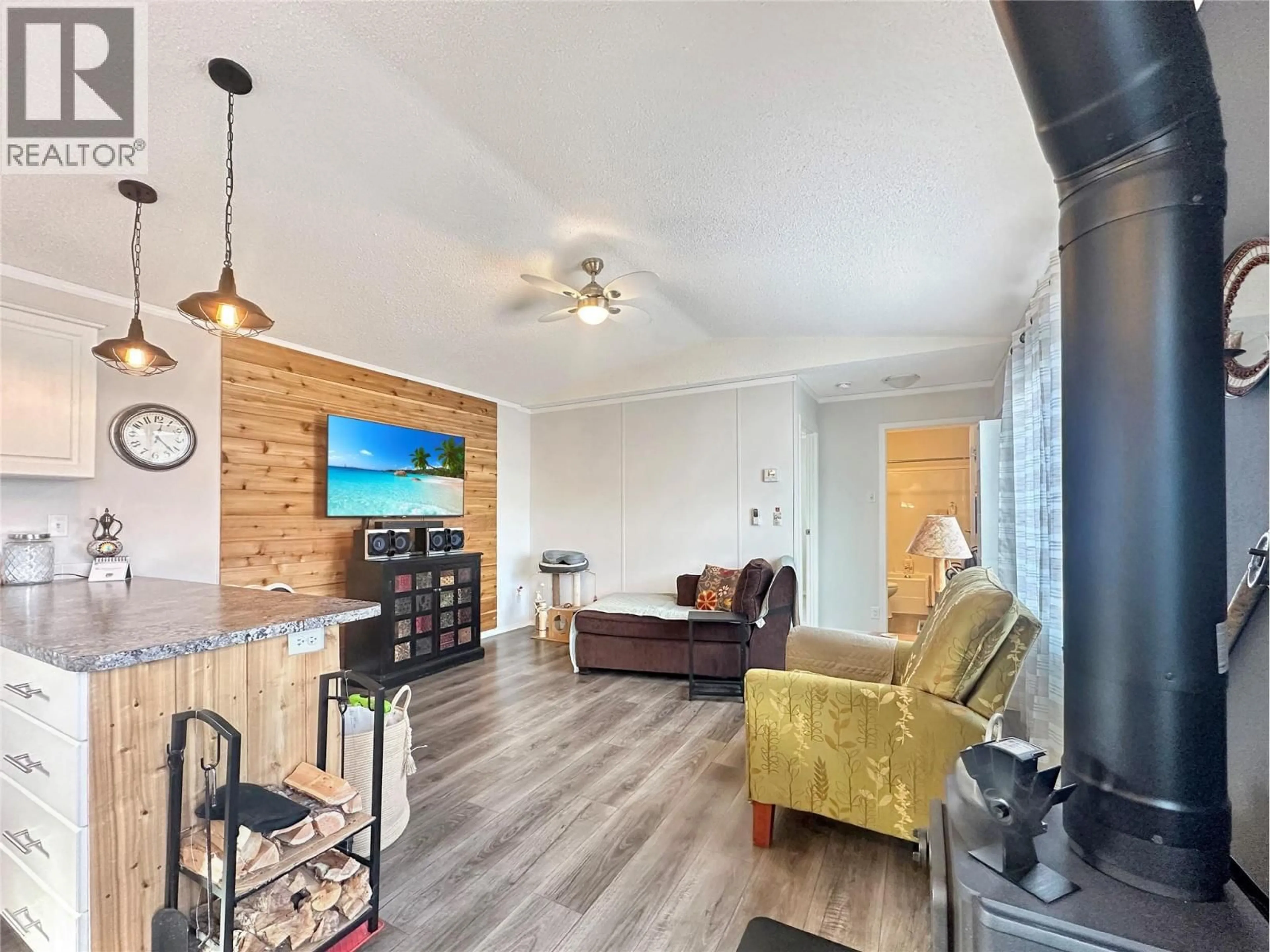 Living room with furniture, wood/laminate floor for 24 - 263 HIGHWAY 3 OTHER, Princeton British Columbia V0X1W0