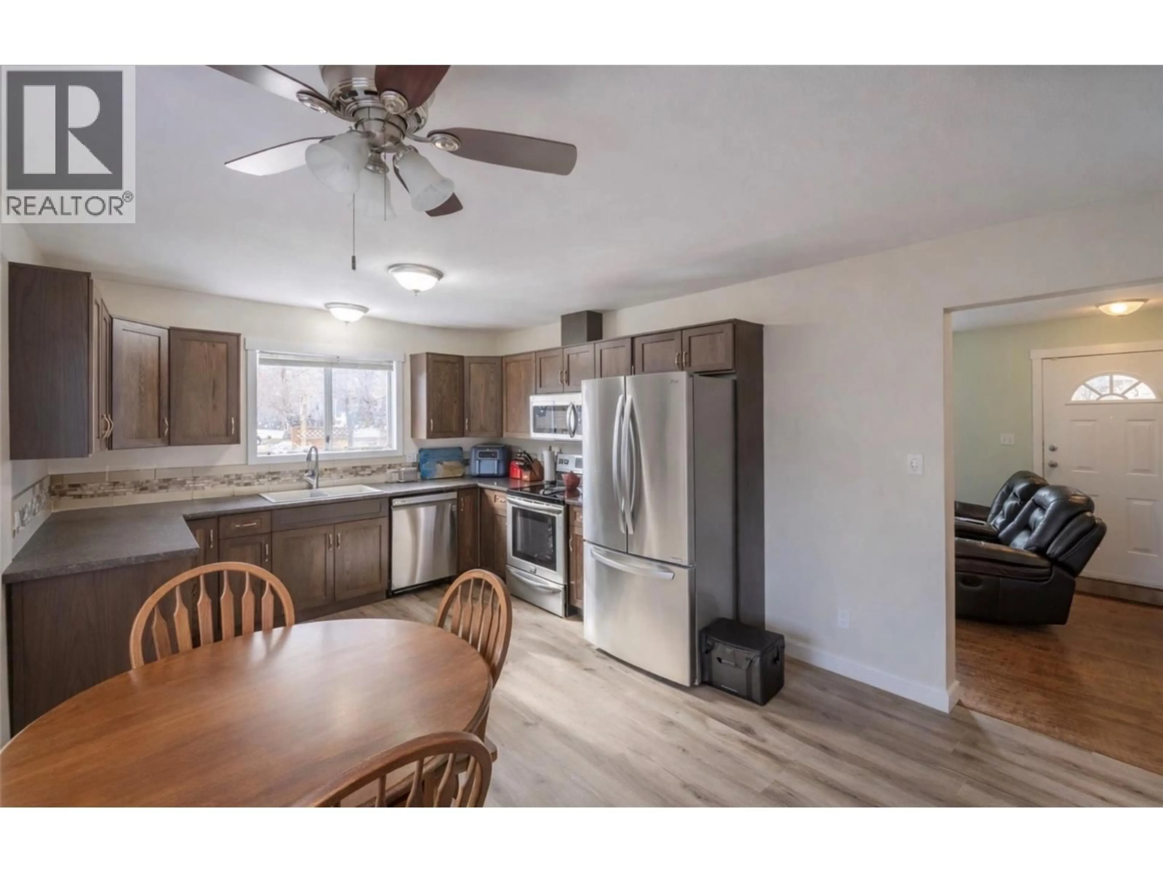 Open concept kitchen, wood/laminate floor for 2052 ATKINSON STREET, Penticton British Columbia V2A8H5