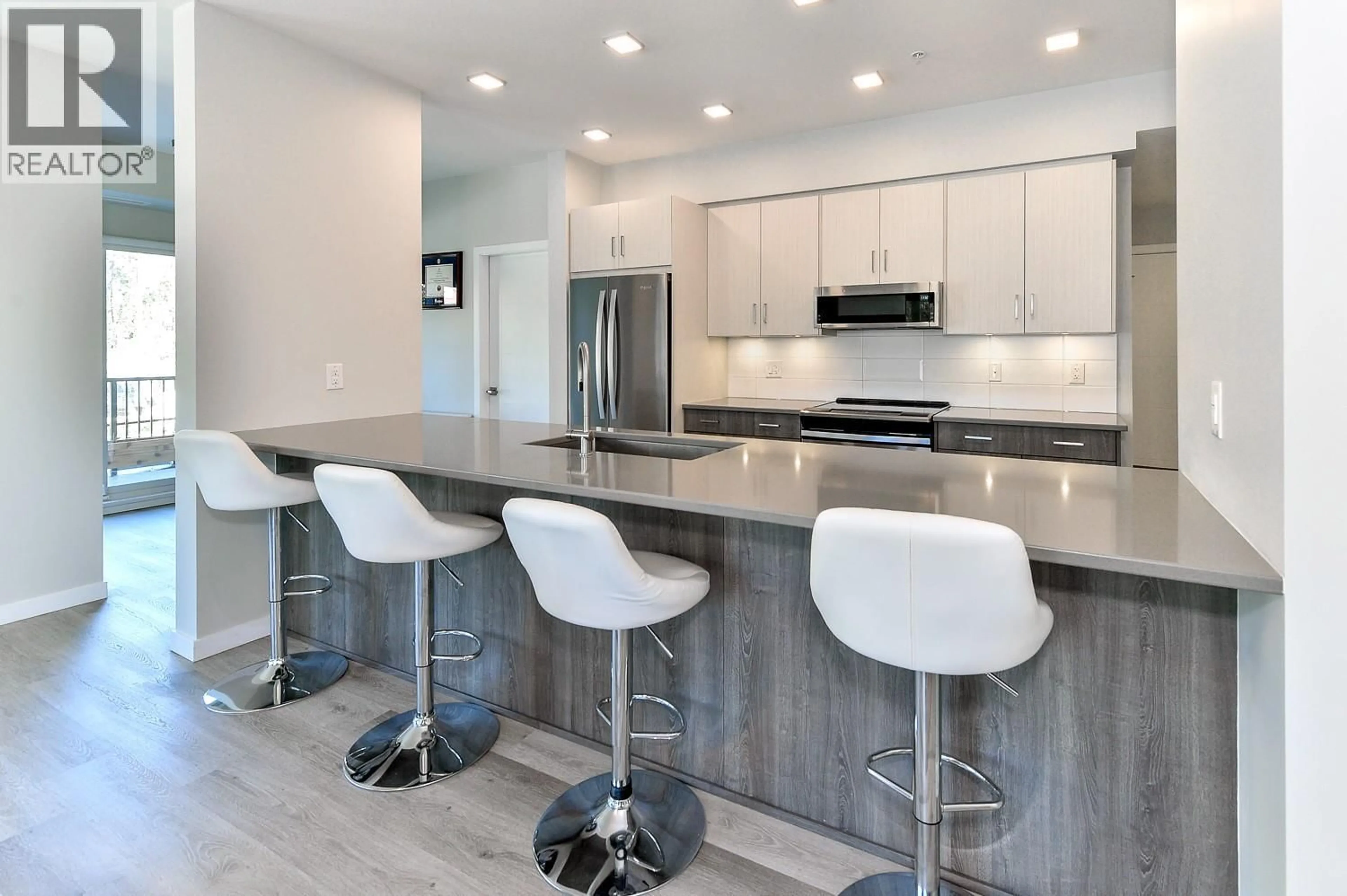 Contemporary kitchen, ceramic/tile floor for 109 - 2301 CARRINGTON ROAD, West Kelowna British Columbia V4T0E2