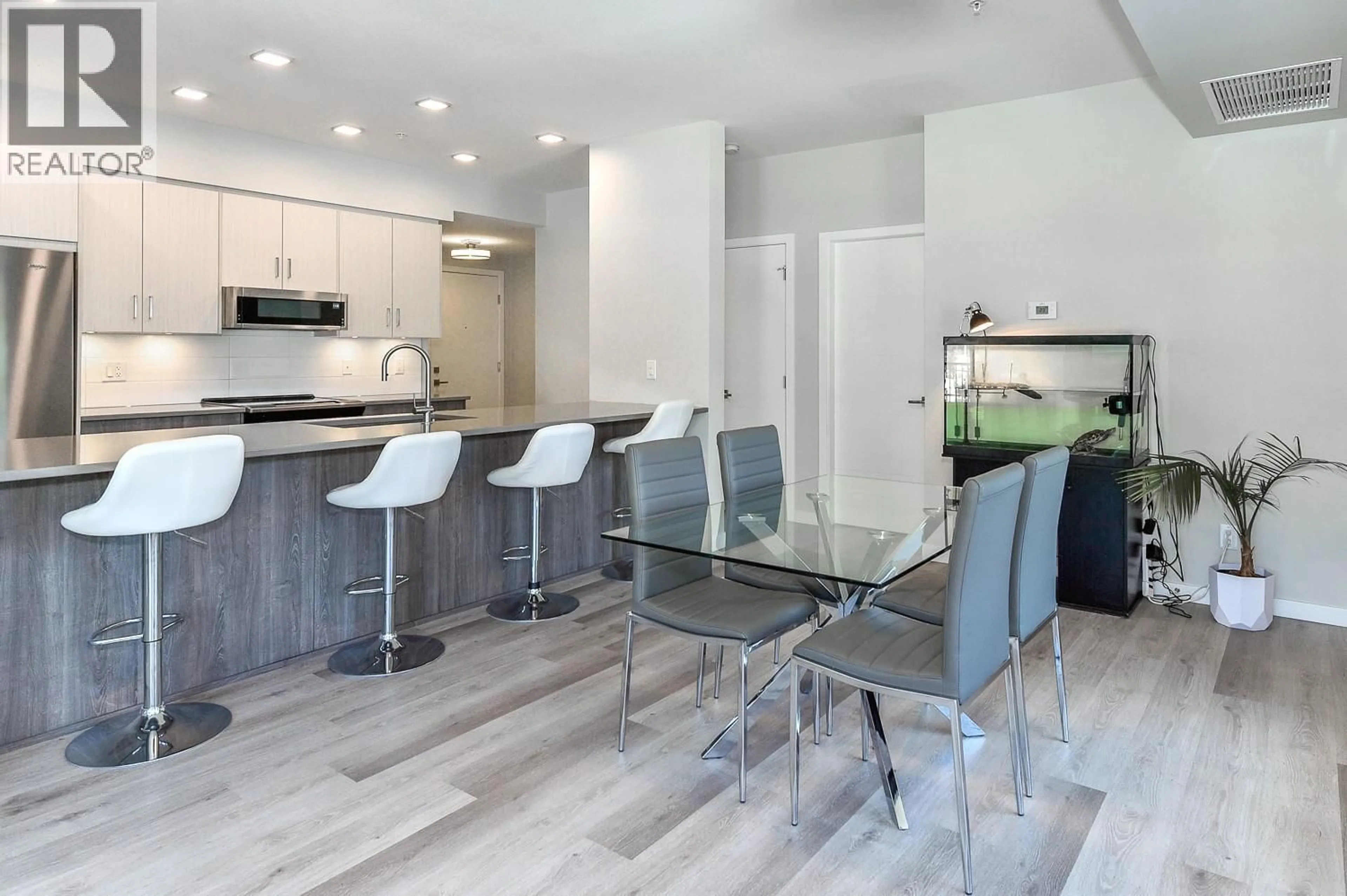 Open concept kitchen, wood/laminate floor for 109 - 2301 CARRINGTON ROAD, West Kelowna British Columbia V4T0E2