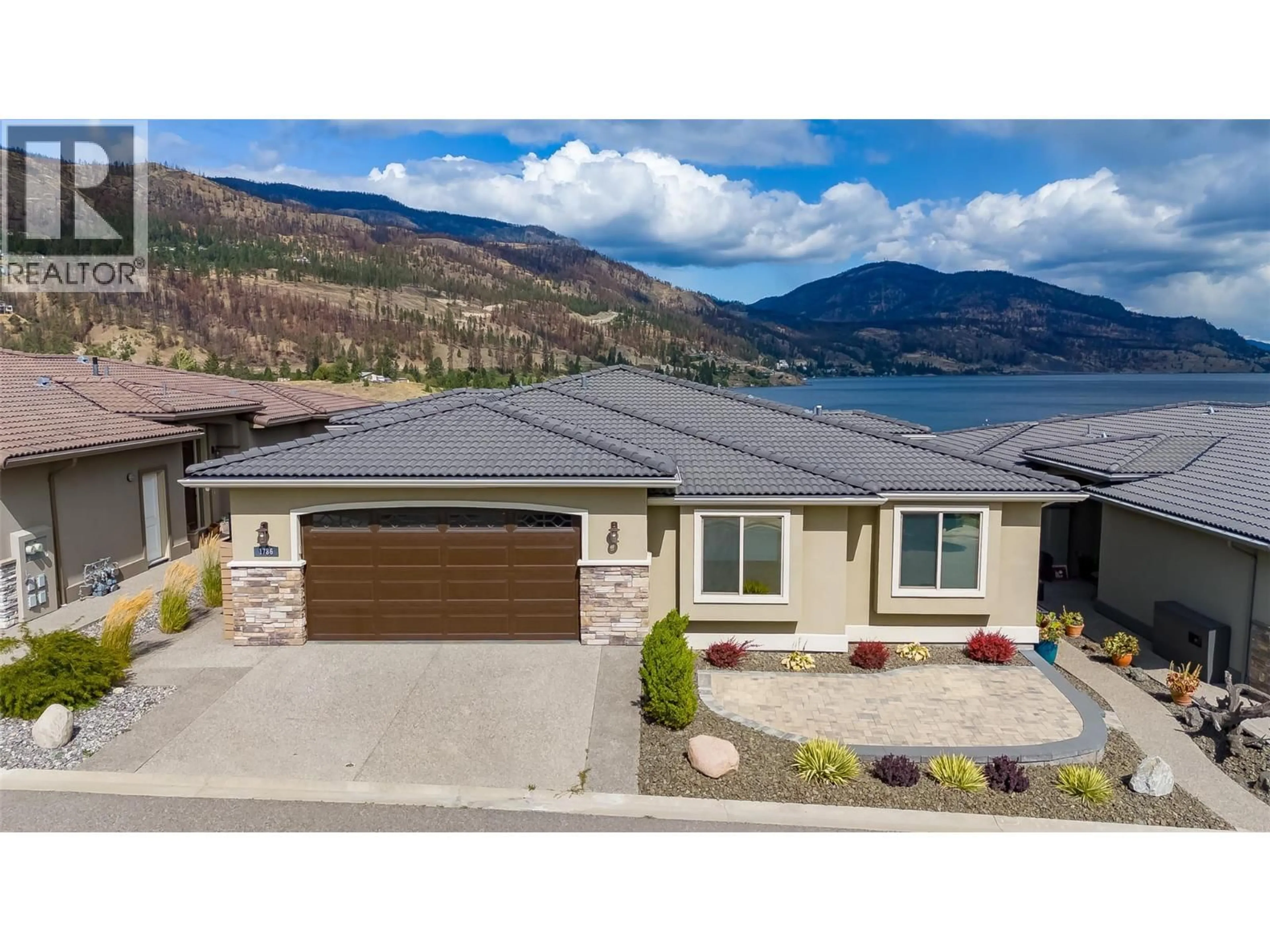 A pic from outside/outdoor area/front of a property/back of a property/a pic from drone, water/lake/river/ocean view for 1786 VIEWPOINT DRIVE, Kelowna British Columbia V1Z4E1