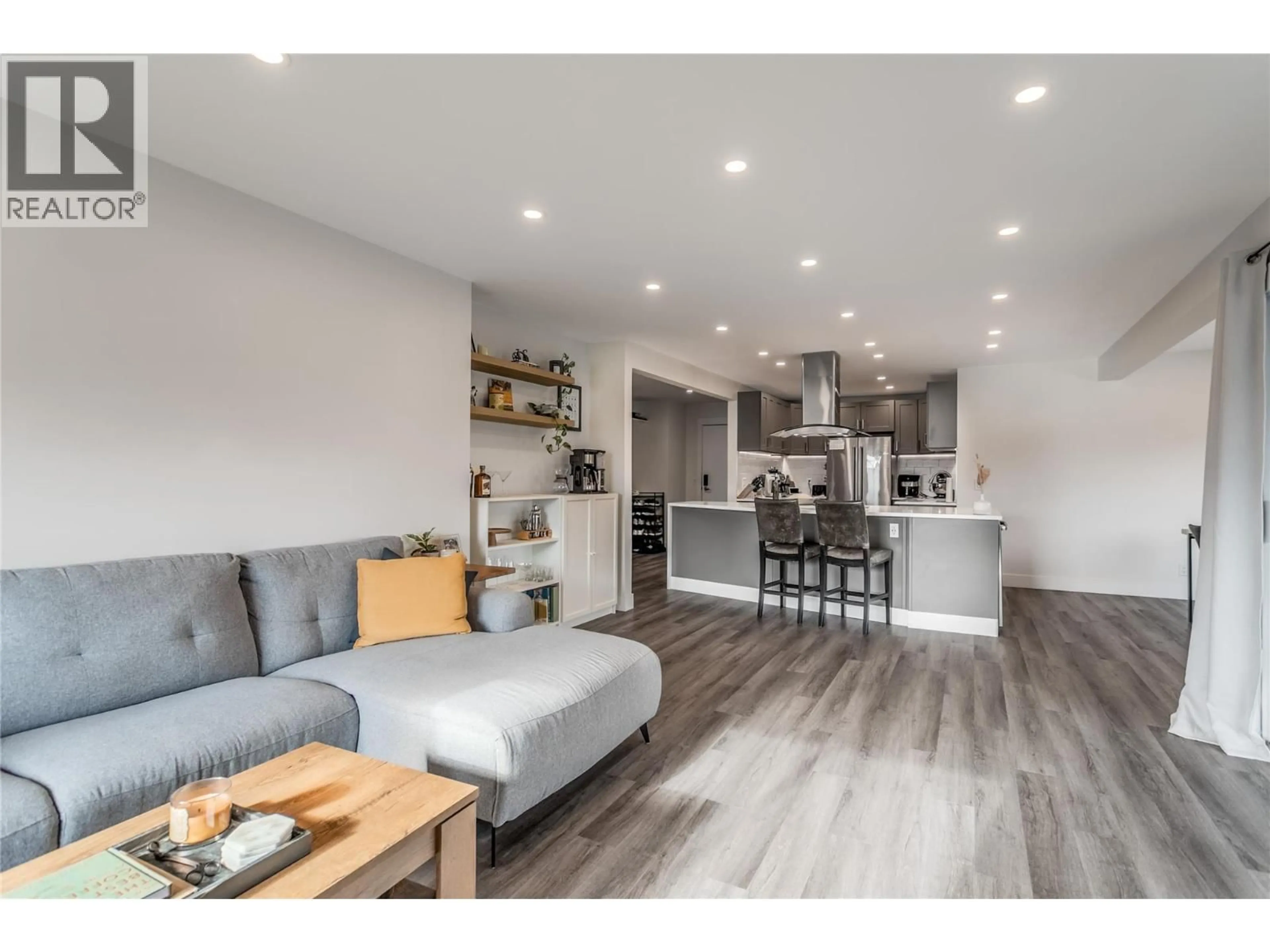 Open concept kitchen, wood/laminate floor for 305 - 1075 BERNARD AVENUE, Kelowna British Columbia V1Y6P7