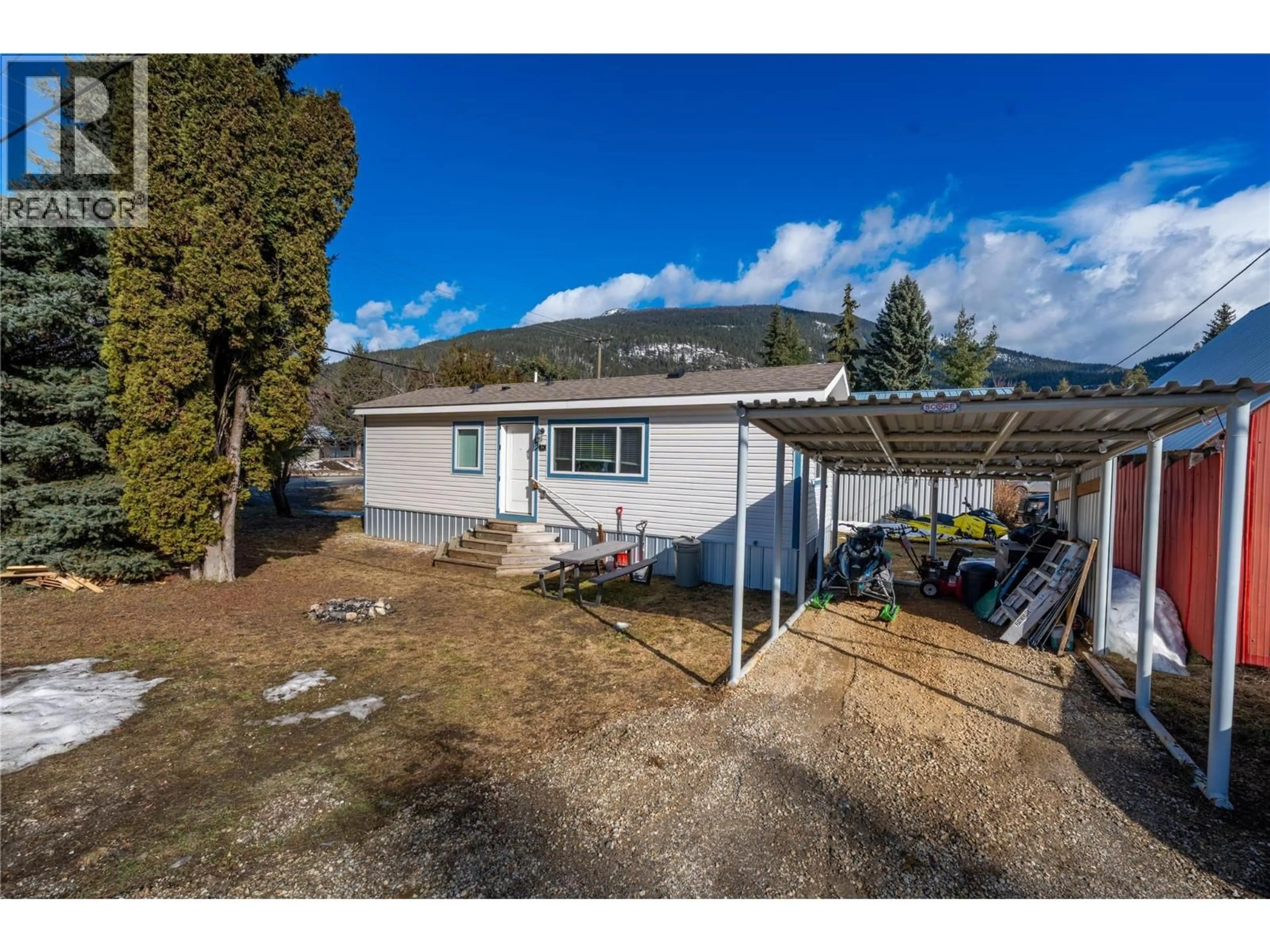 A pic from outside/outdoor area/front of a property/back of a property/a pic from drone, mountain view for 1A - 1204 MAPLEWOOD STREET, Revelstoke British Columbia V0E2S0