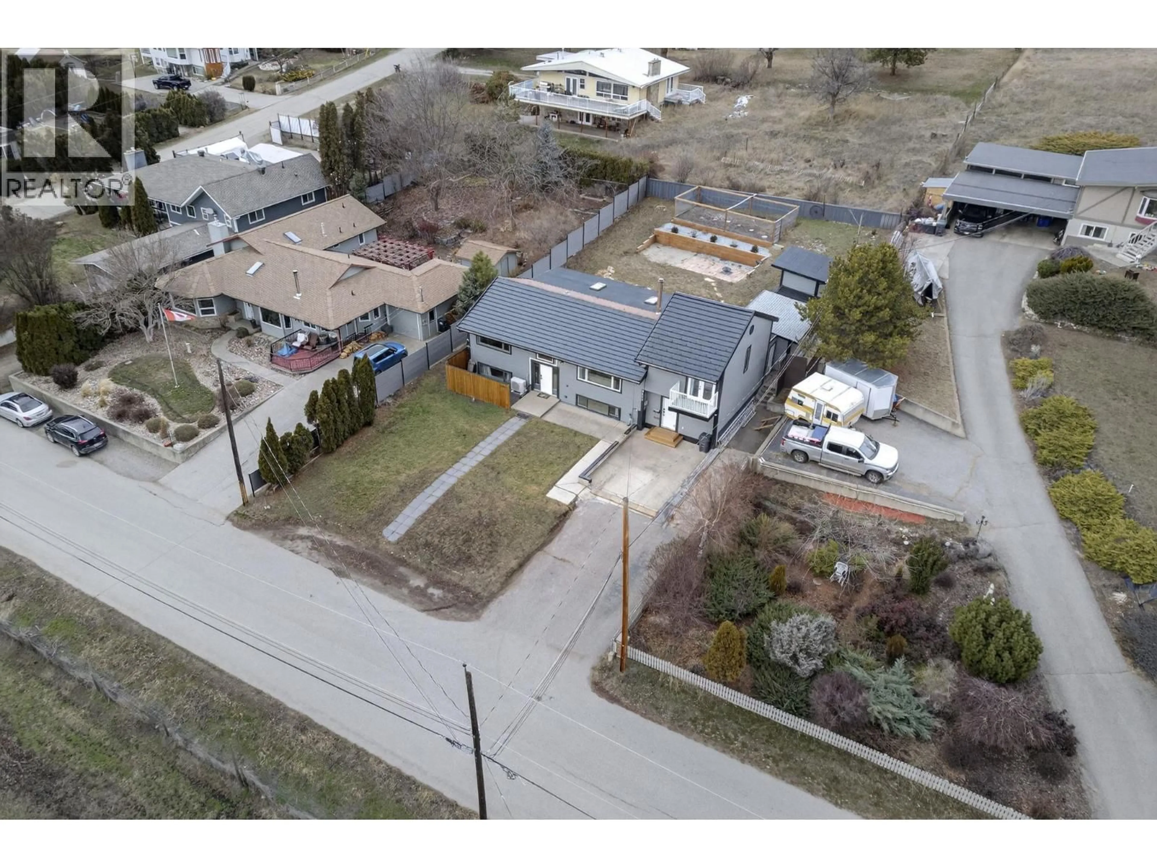 A pic from outside/outdoor area/front of a property/back of a property/a pic from drone, street for 9803 VENABLES DRIVE, Coldstream British Columbia V1B2K1