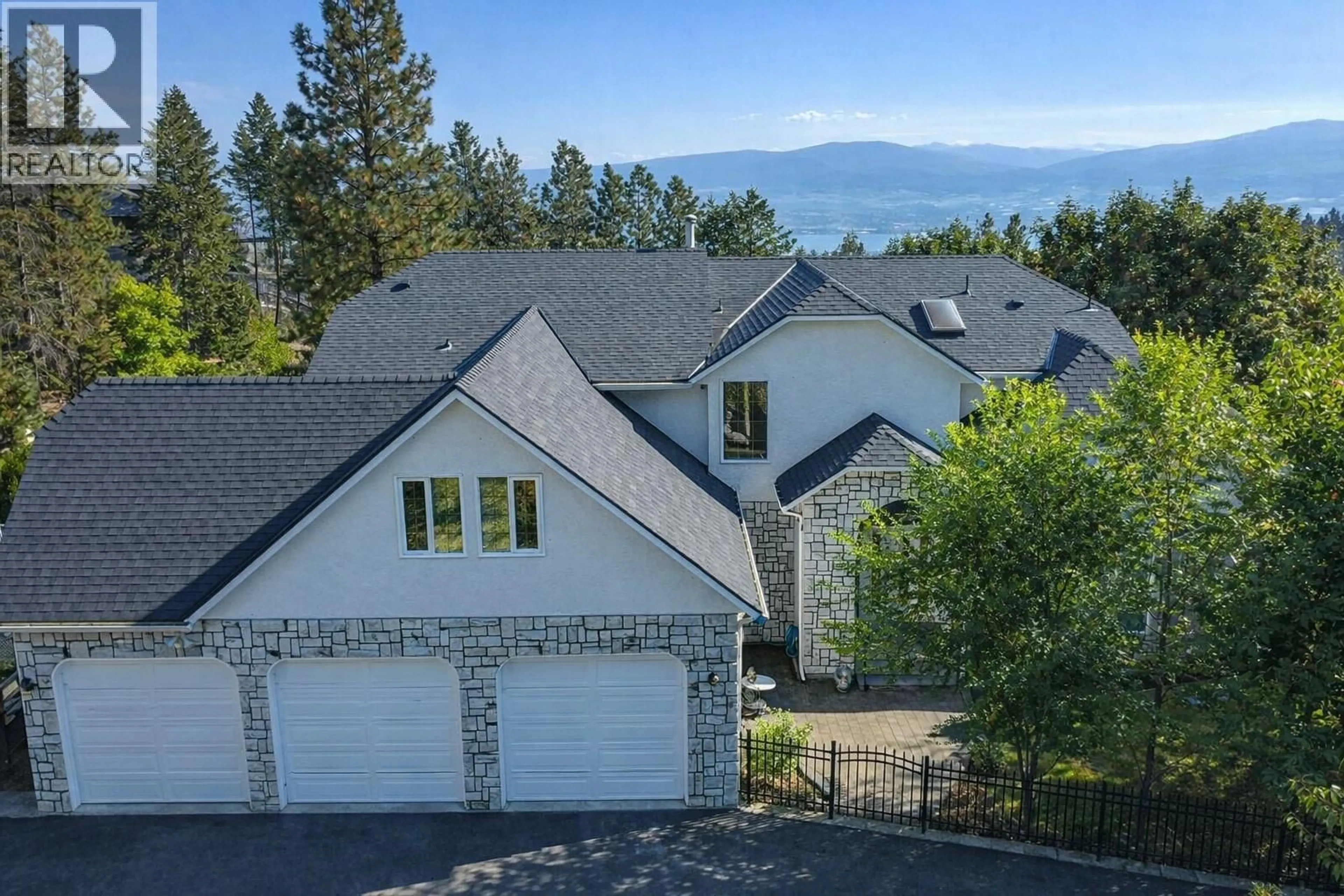 A pic from outside/outdoor area/front of a property/back of a property/a pic from drone, mountain view for 1465 WEST KELOWNA ROAD, West Kelowna British Columbia V1Z3L2