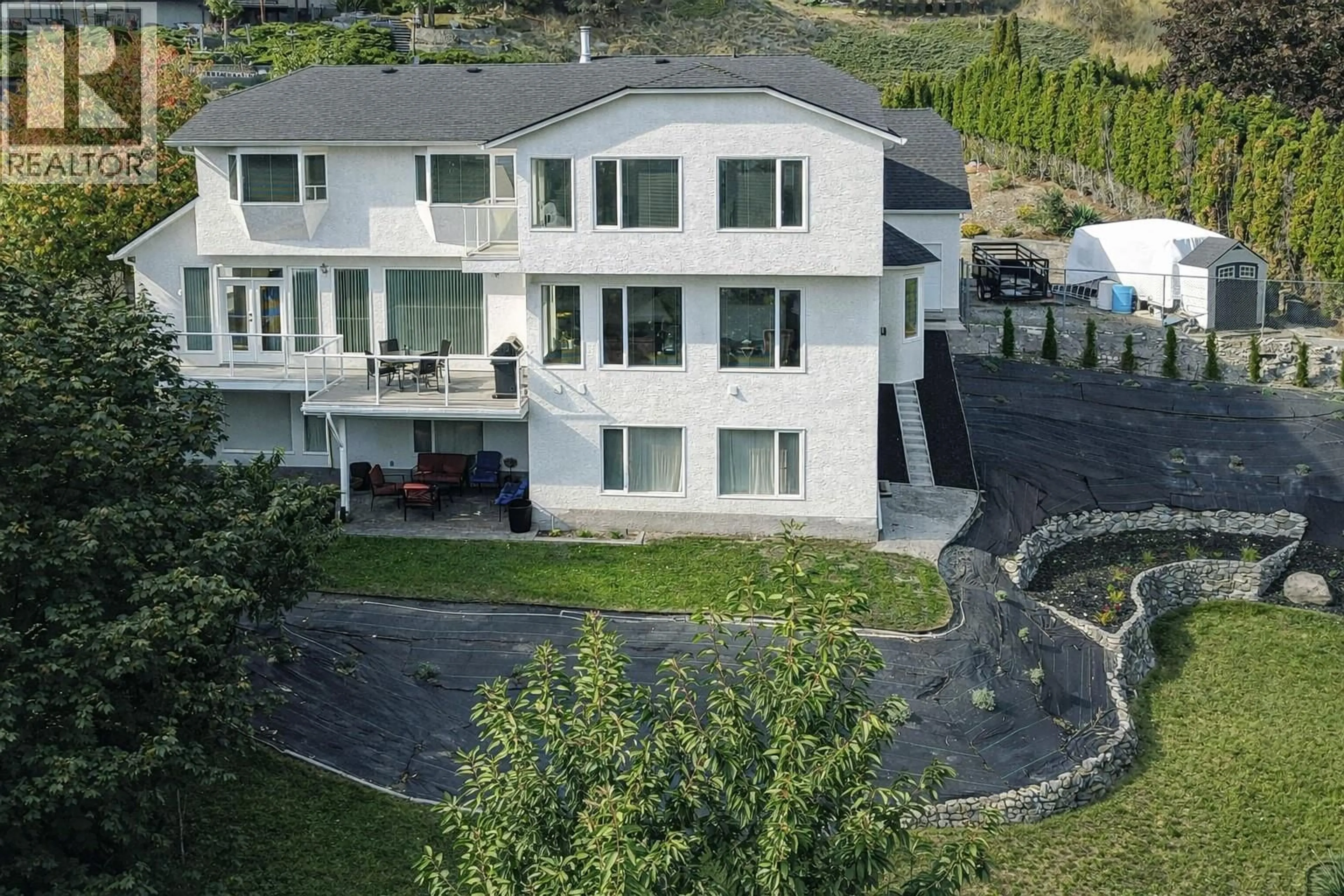 A pic from outside/outdoor area/front of a property/back of a property/a pic from drone, mountain view for 1465 WEST KELOWNA ROAD, West Kelowna British Columbia V1Z3L2