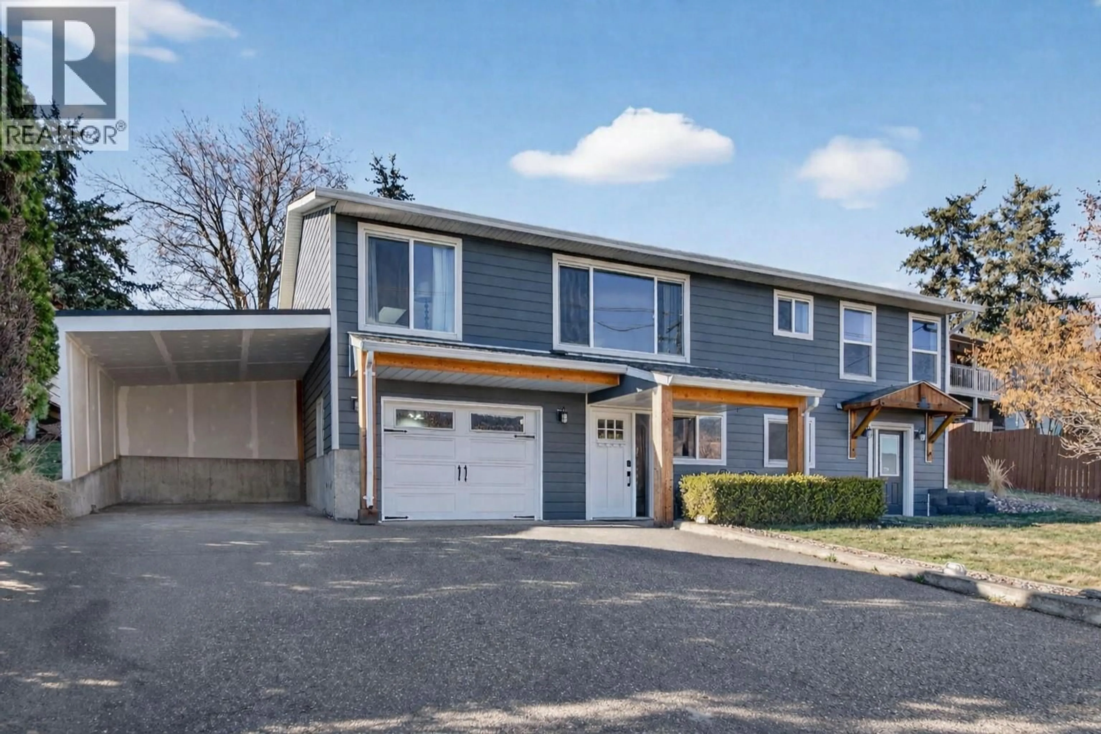 Home with vinyl exterior material, street for 9710 OKANAGAN CENTRE ROAD EAST, Lake Country British Columbia V4V1T6