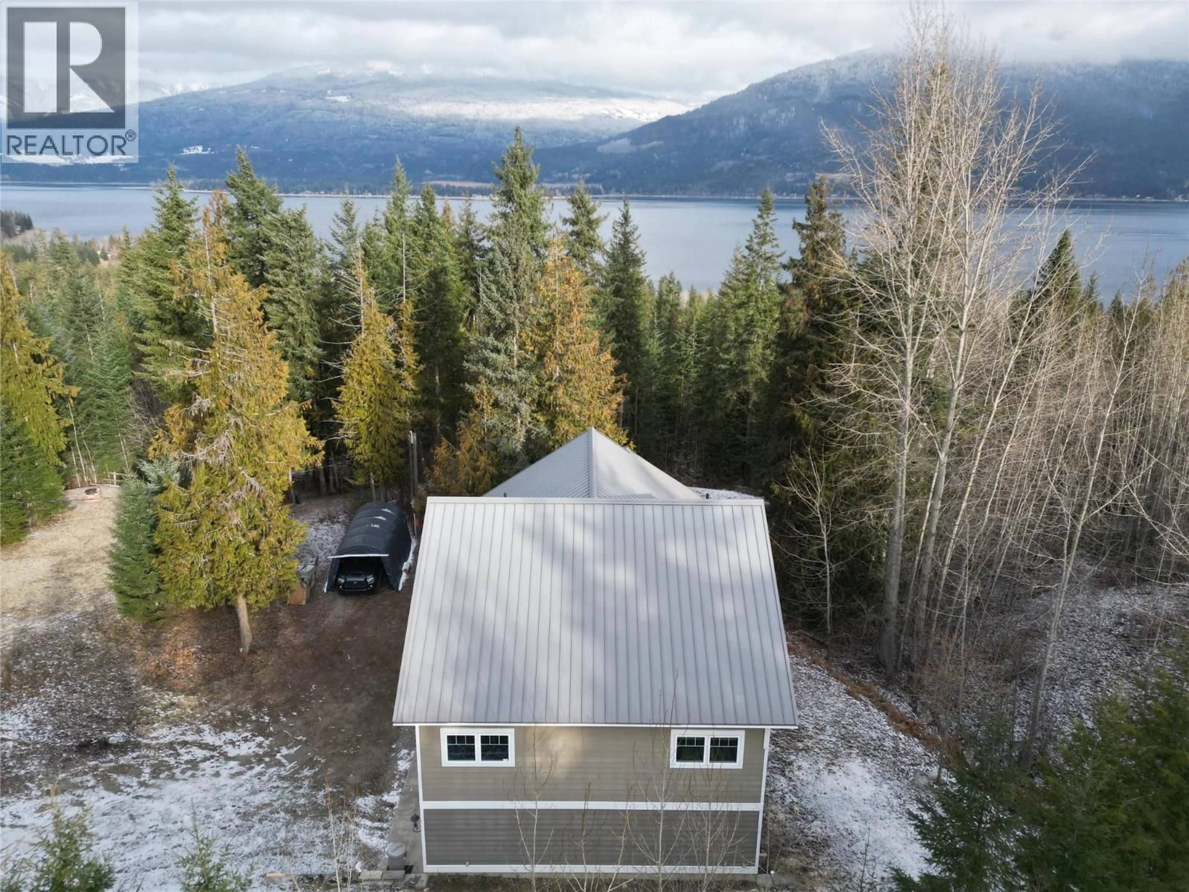A pic from outside/outdoor area/front of a property/back of a property/a pic from drone, water/lake/river/ocean view for 3970 TALIN PLACE, Eagle Bay British Columbia V0E1T0