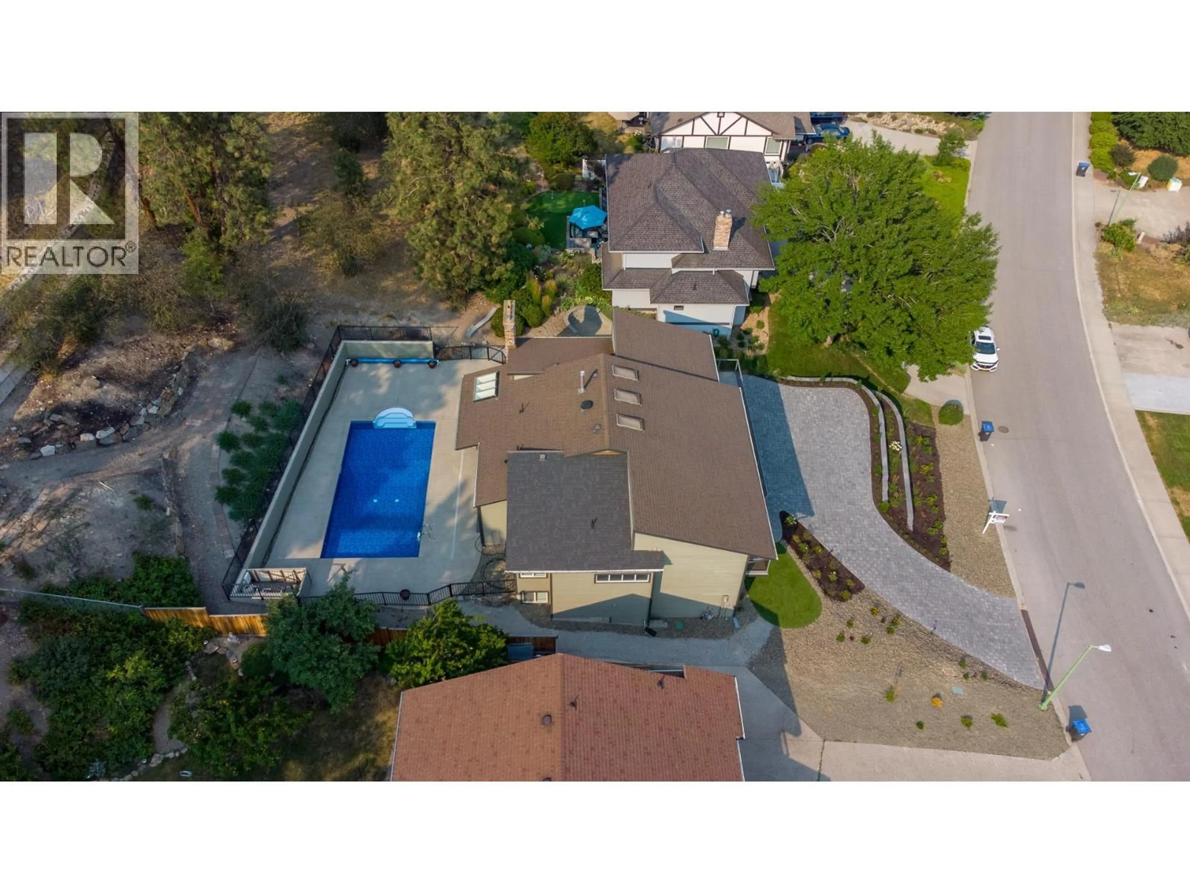 A pic from outside/outdoor area/front of a property/back of a property/a pic from drone, street for 2218 OMINECA PLACE, Kelowna British Columbia V1V1H7