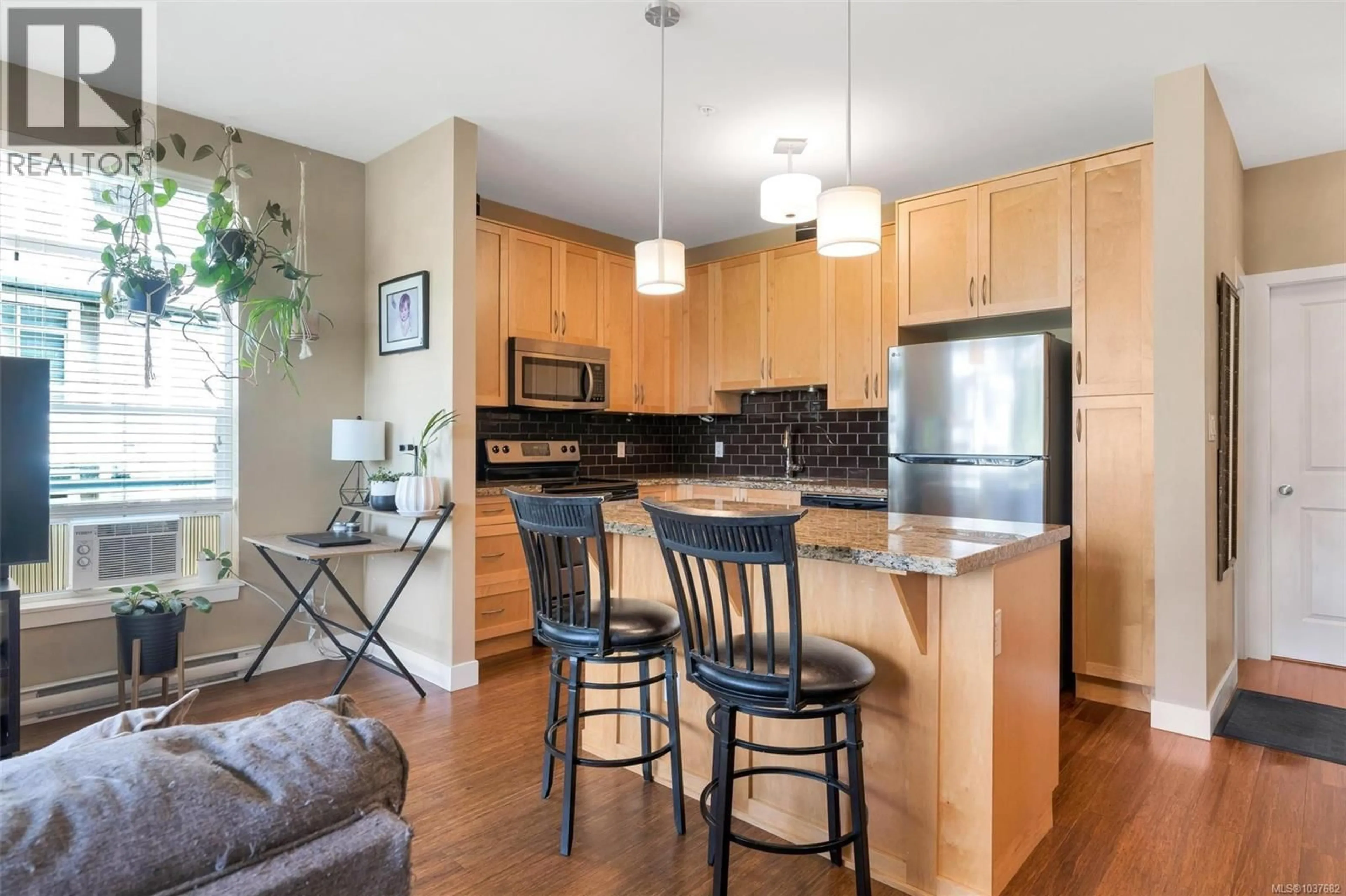 Open concept kitchen, wood/laminate floor for 302 - 608 FAIRWAY AVENUE, Langford British Columbia V9B2R5