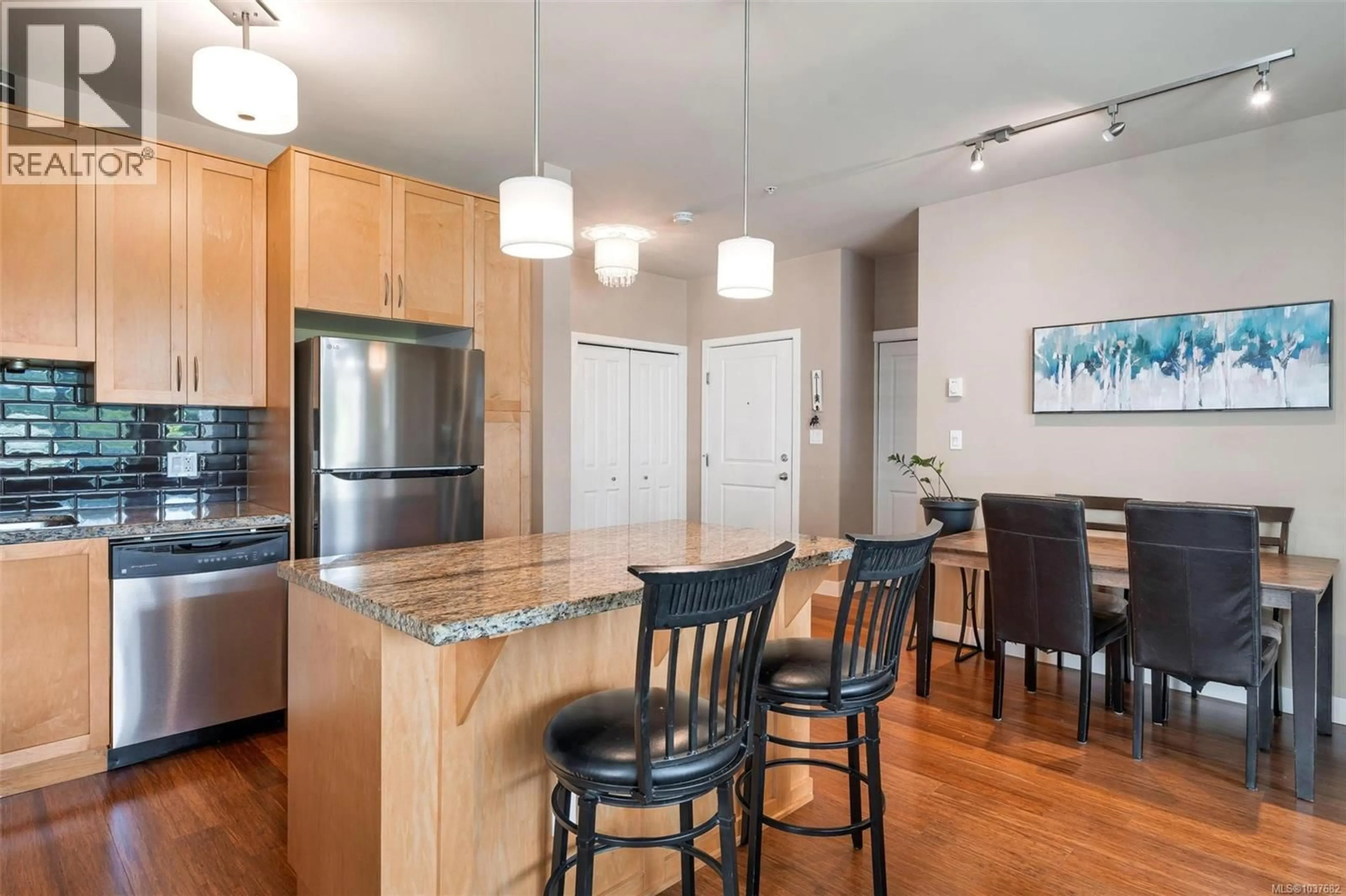 Open concept kitchen, wood/laminate floor for 302 - 608 FAIRWAY AVENUE, Langford British Columbia V9B2R5