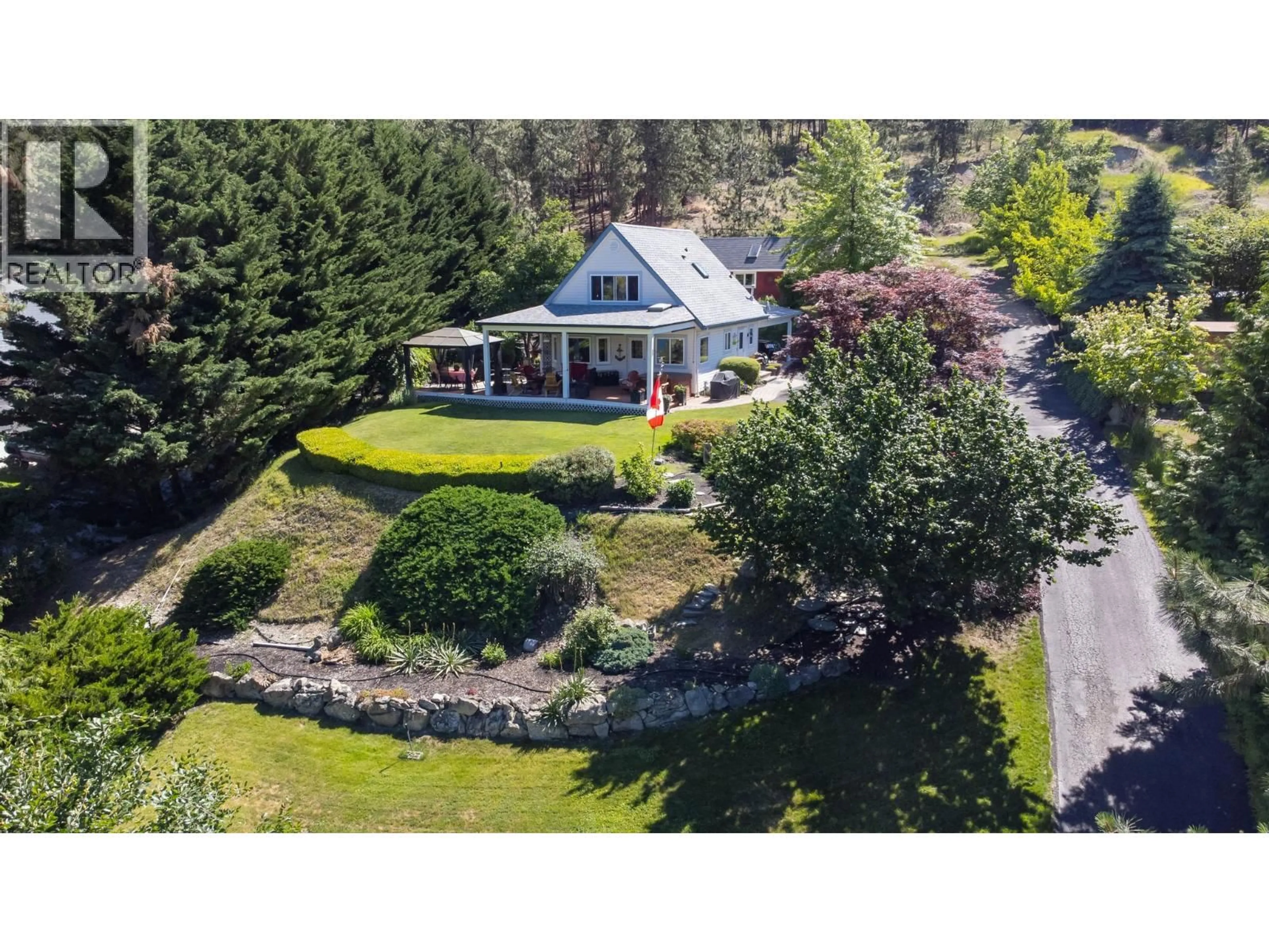 A pic from outside/outdoor area/front of a property/back of a property/a pic from drone, unknown for 10987 HARE ROAD, Lake Country British Columbia V4V2H6