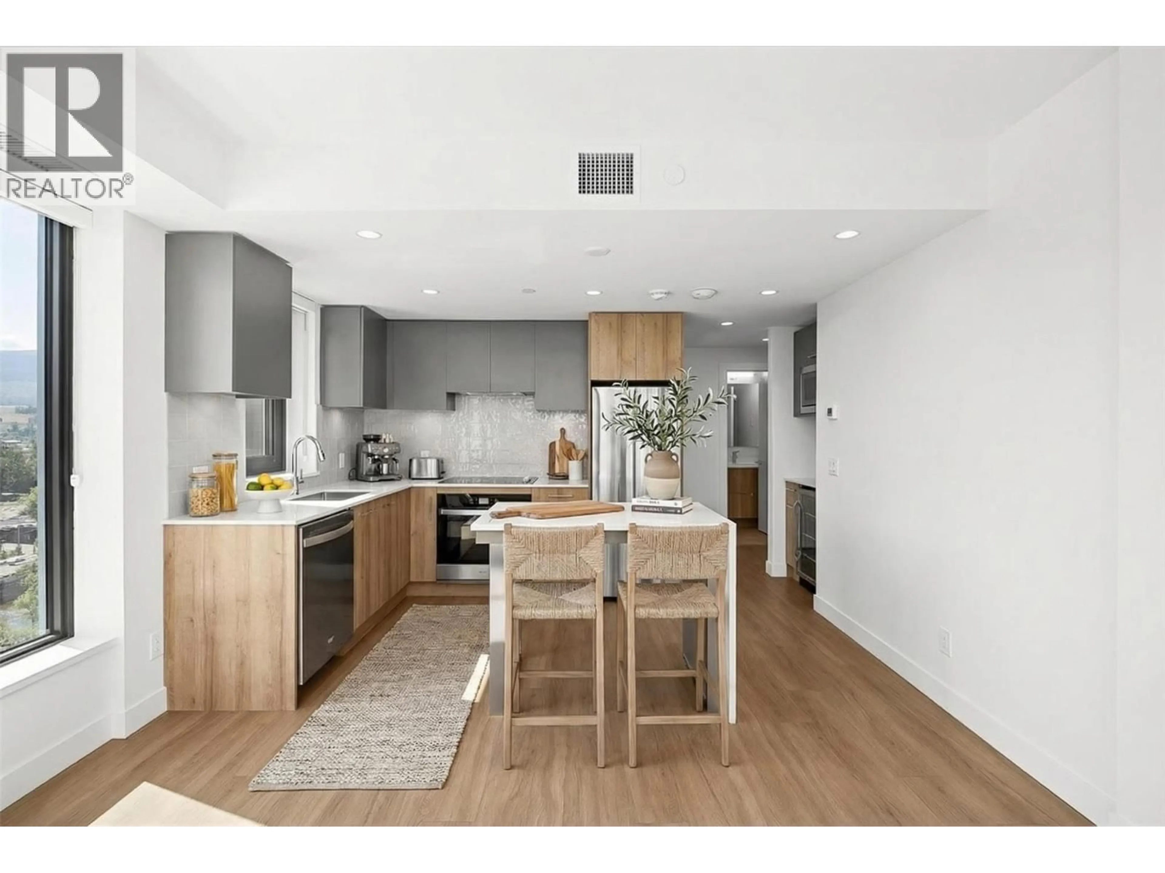 Open concept kitchen, wood/laminate floor for 1302 - 3699 CAPOZZI ROAD, Kelowna British Columbia V1W0G3