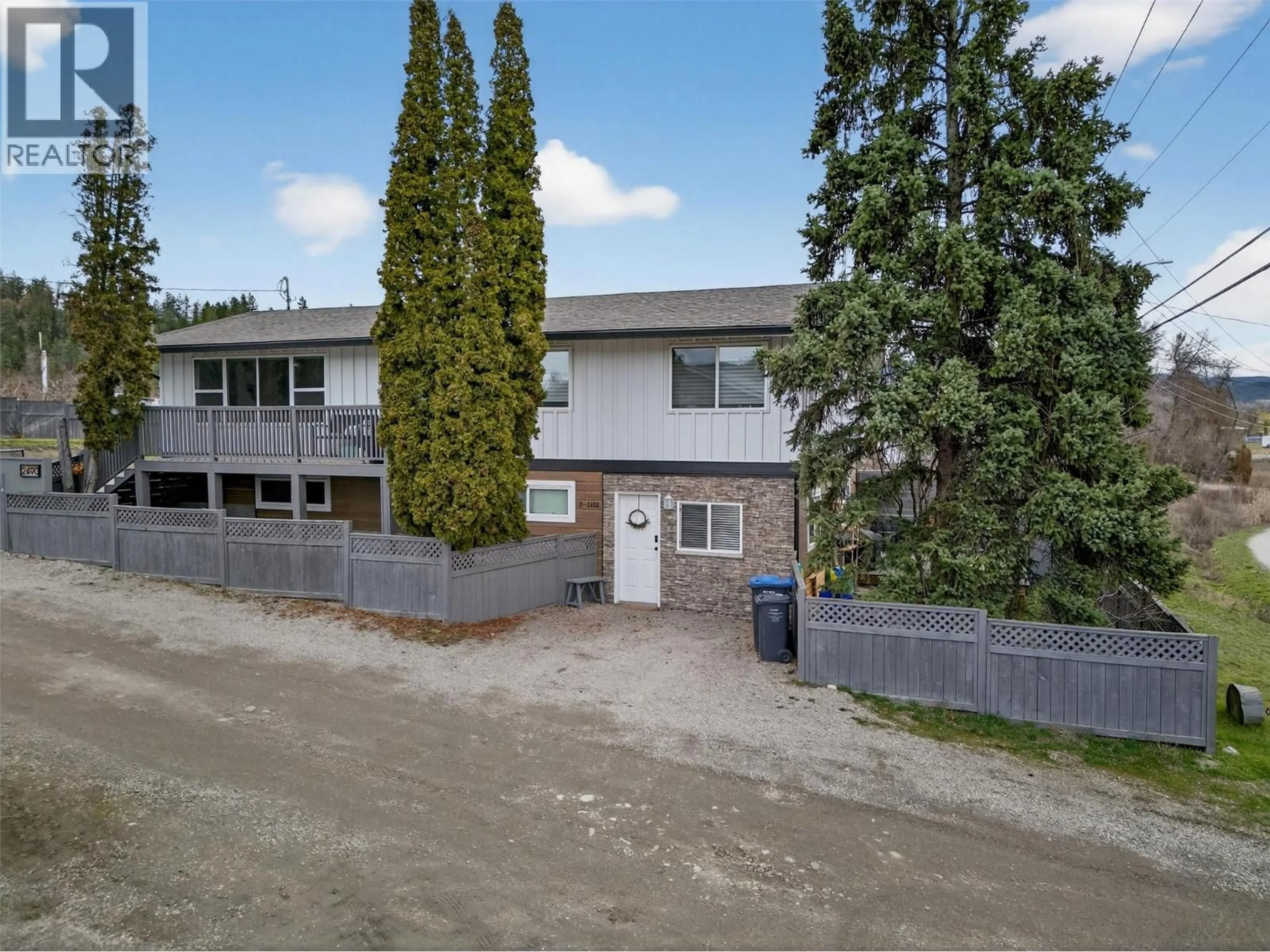 A pic from outside/outdoor area/front of a property/back of a property/a pic from drone, building for 2490 SEXSMITH ROAD, Kelowna British Columbia V1V2E9