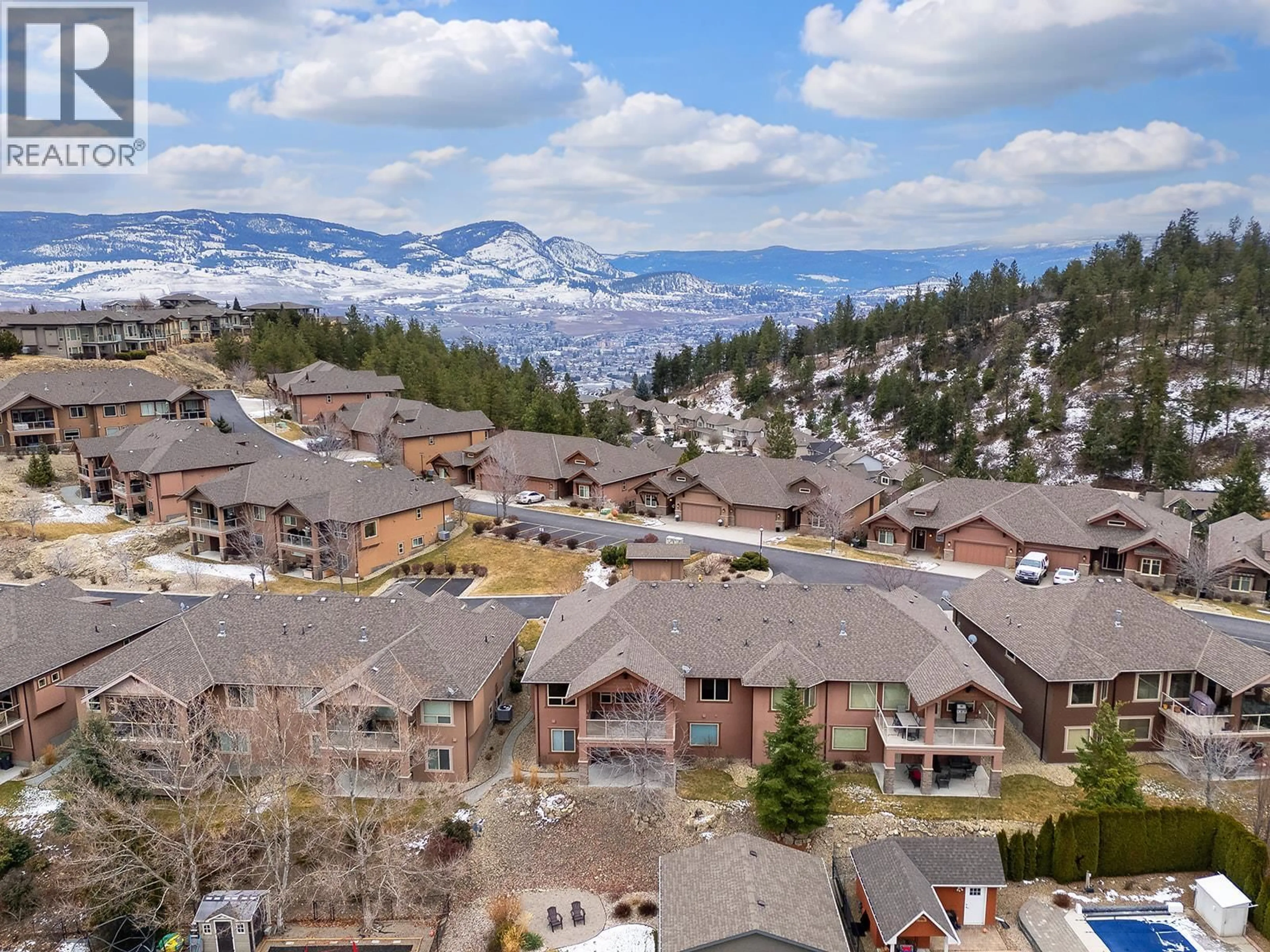 A pic from outside/outdoor area/front of a property/back of a property/a pic from drone, mountain view for 3 - 2450 SELKIRK DRIVE, Kelowna British Columbia V1V2Z5