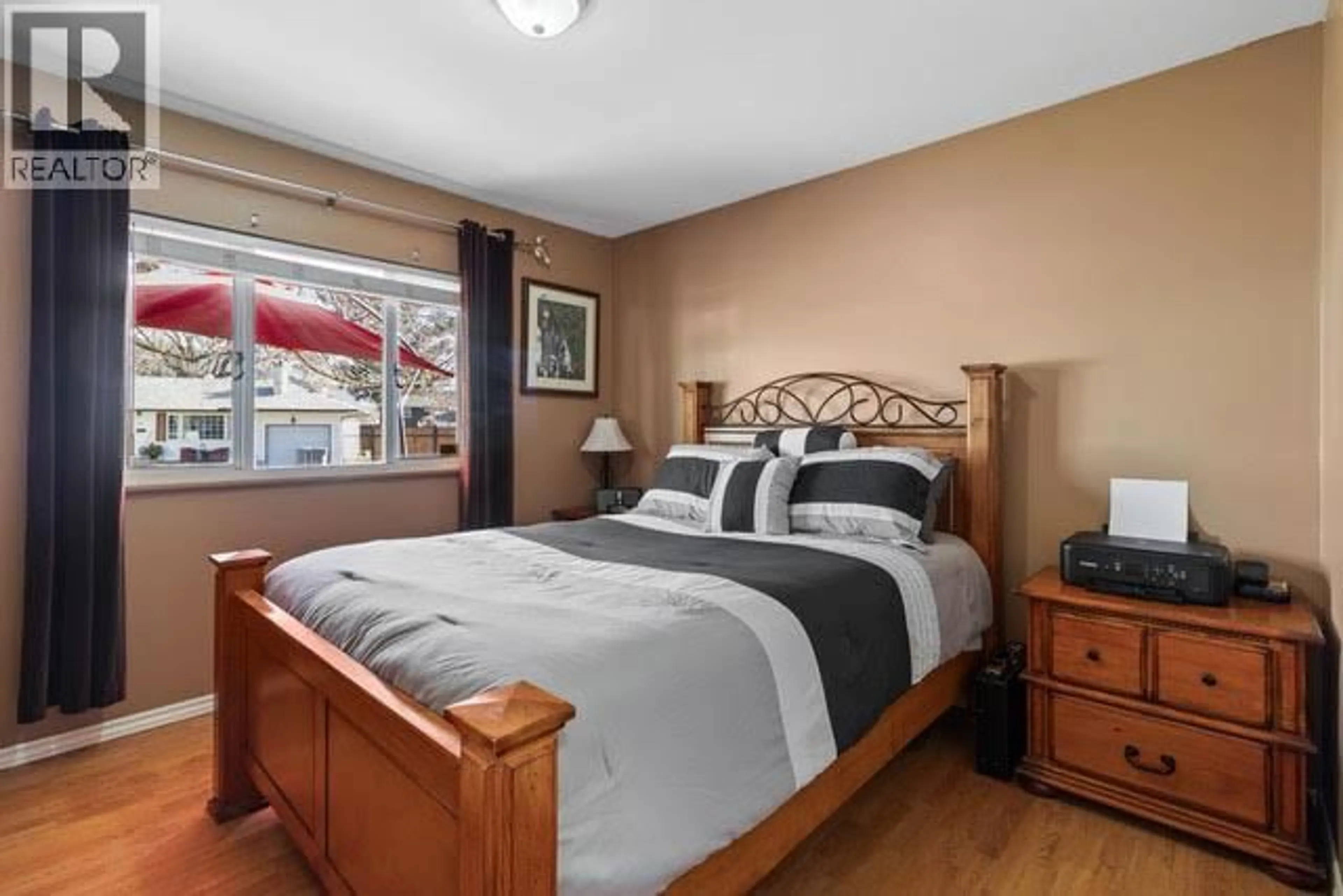 Bedroom with bed, wood/laminate floor for 601 REGINA AVENUE, Kamloops British Columbia V2B1N6