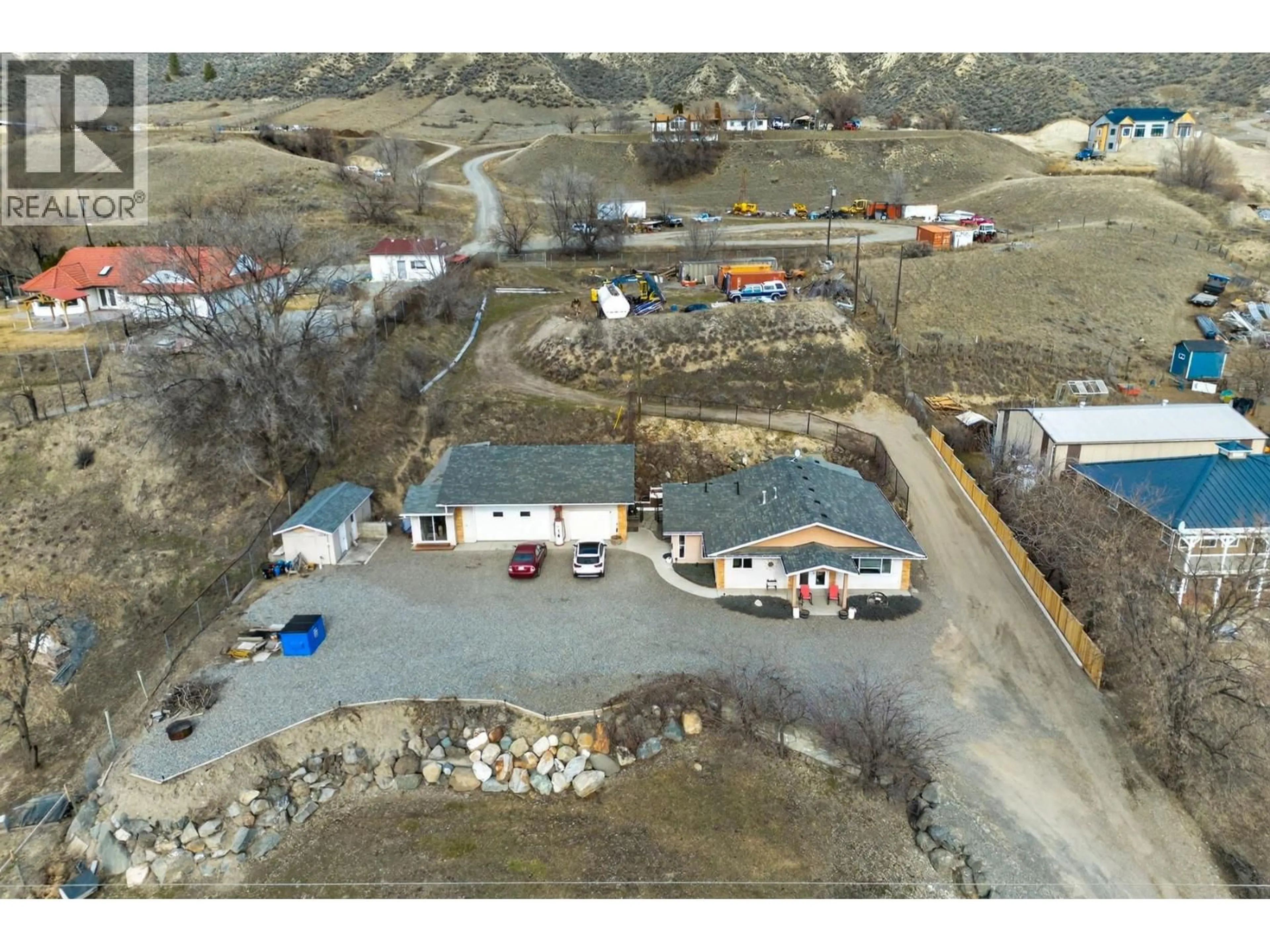 A pic from outside/outdoor area/front of a property/back of a property/a pic from drone, street for 3197 SHUSWAP ROAD, Kamloops British Columbia V2H1T1