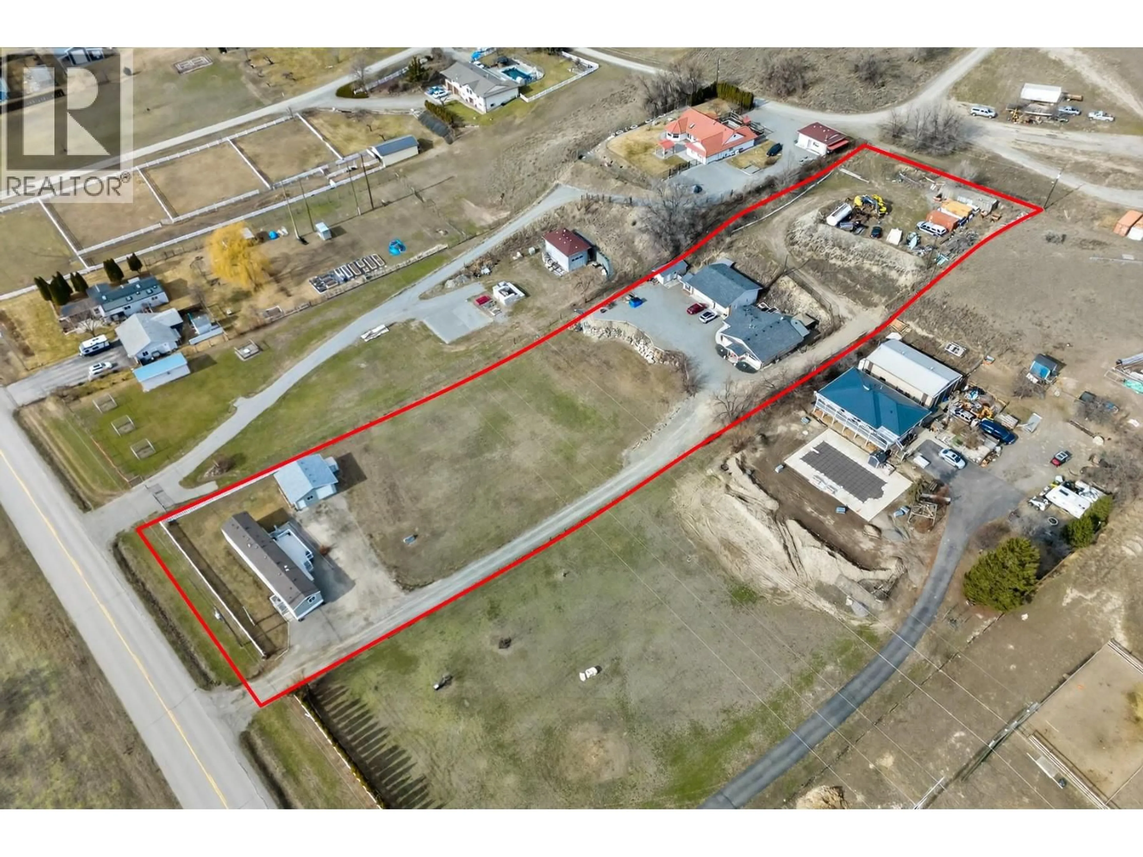 A pic from outside/outdoor area/front of a property/back of a property/a pic from drone, building for 3197 SHUSWAP ROAD, Kamloops British Columbia V2H1T1