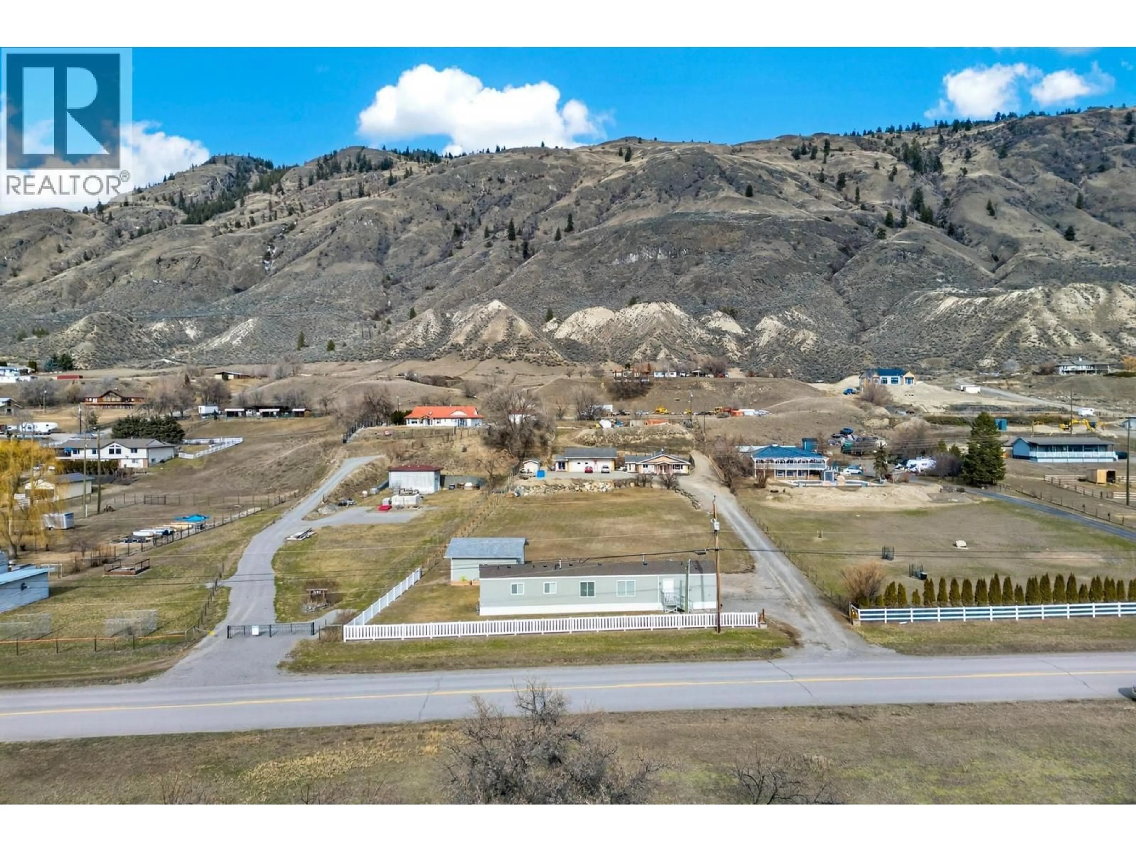 A pic from outside/outdoor area/front of a property/back of a property/a pic from drone, mountain view for 3197 SHUSWAP ROAD, Kamloops British Columbia V2H1T1