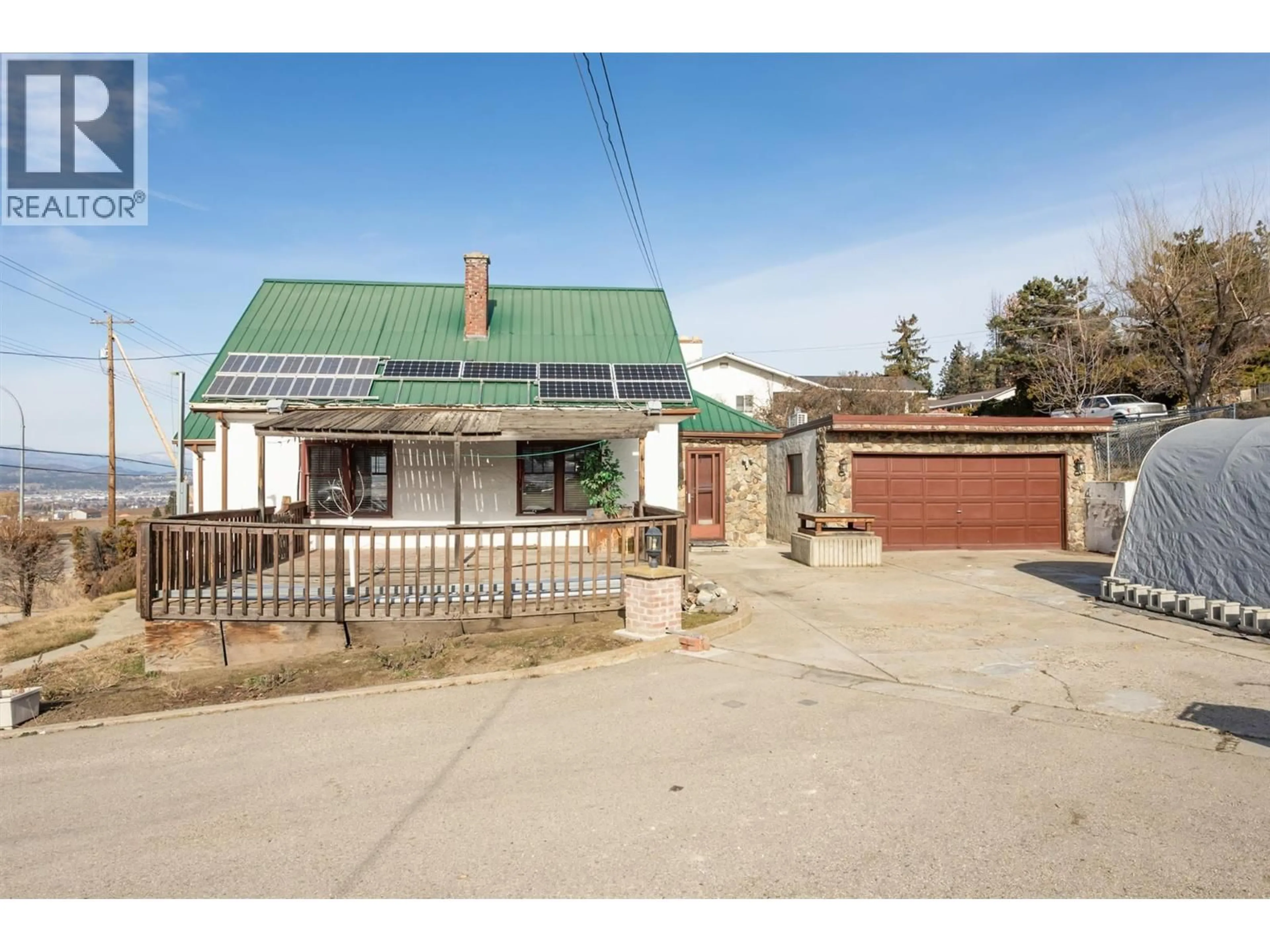 A pic from outside/outdoor area/front of a property/back of a property/a pic from drone, street for 1260 HIGHWAY 33 OTHER, Kelowna British Columbia V1P1M1