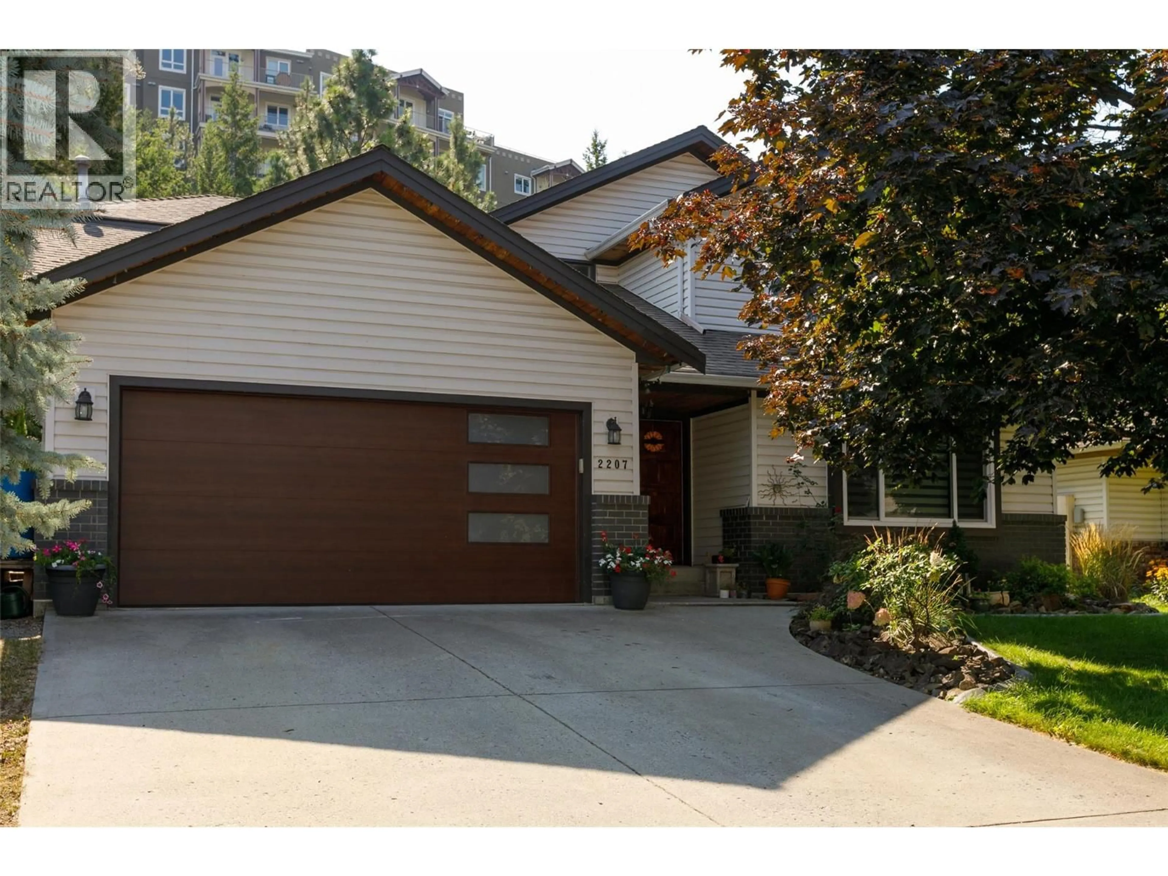 Home with vinyl exterior material, street for 2207 SHANNON RIDGE DRIVE, West Kelowna British Columbia V4T2L1