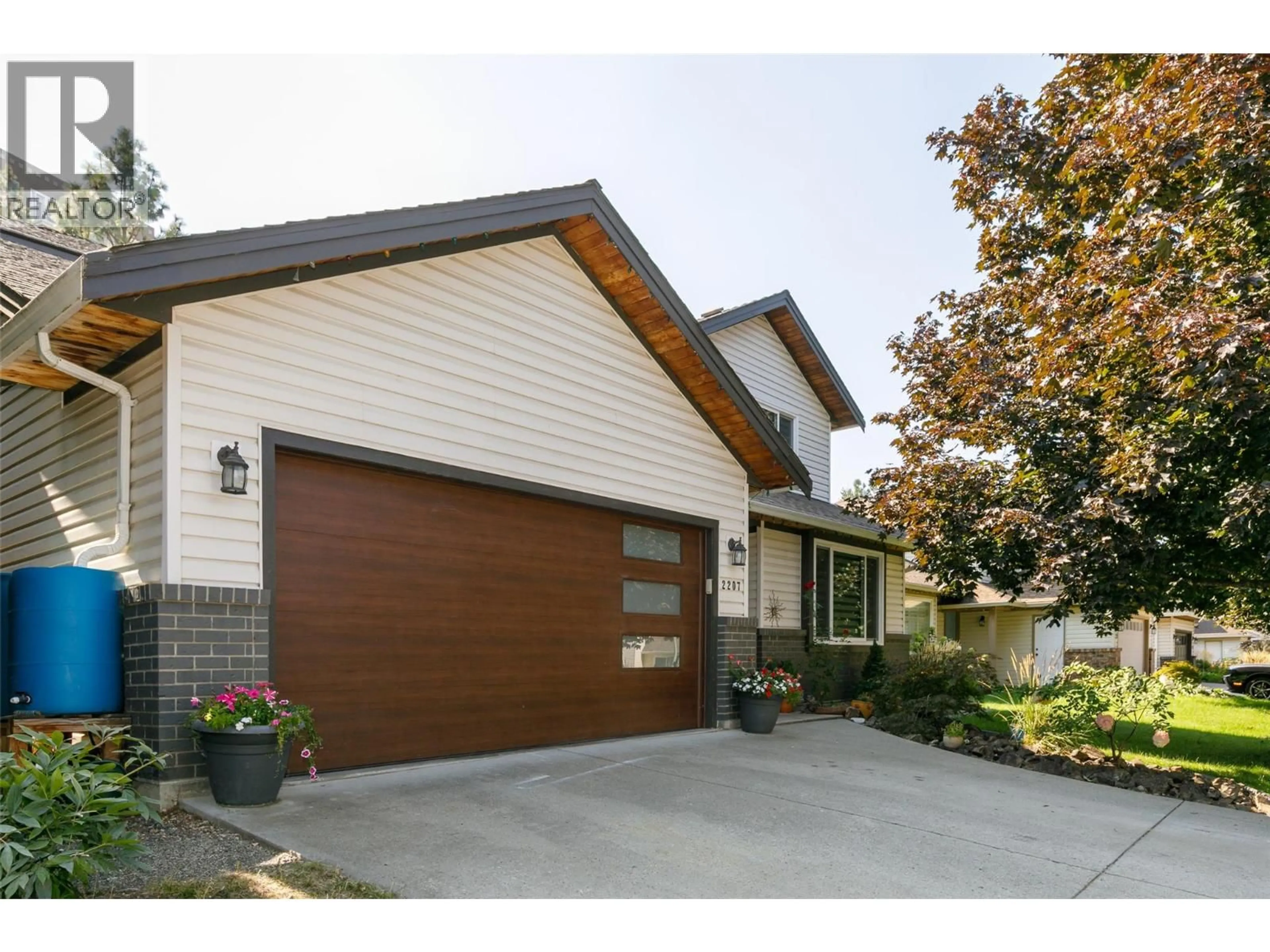 Home with brick exterior material, street for 2207 SHANNON RIDGE DRIVE, West Kelowna British Columbia V4T2L1