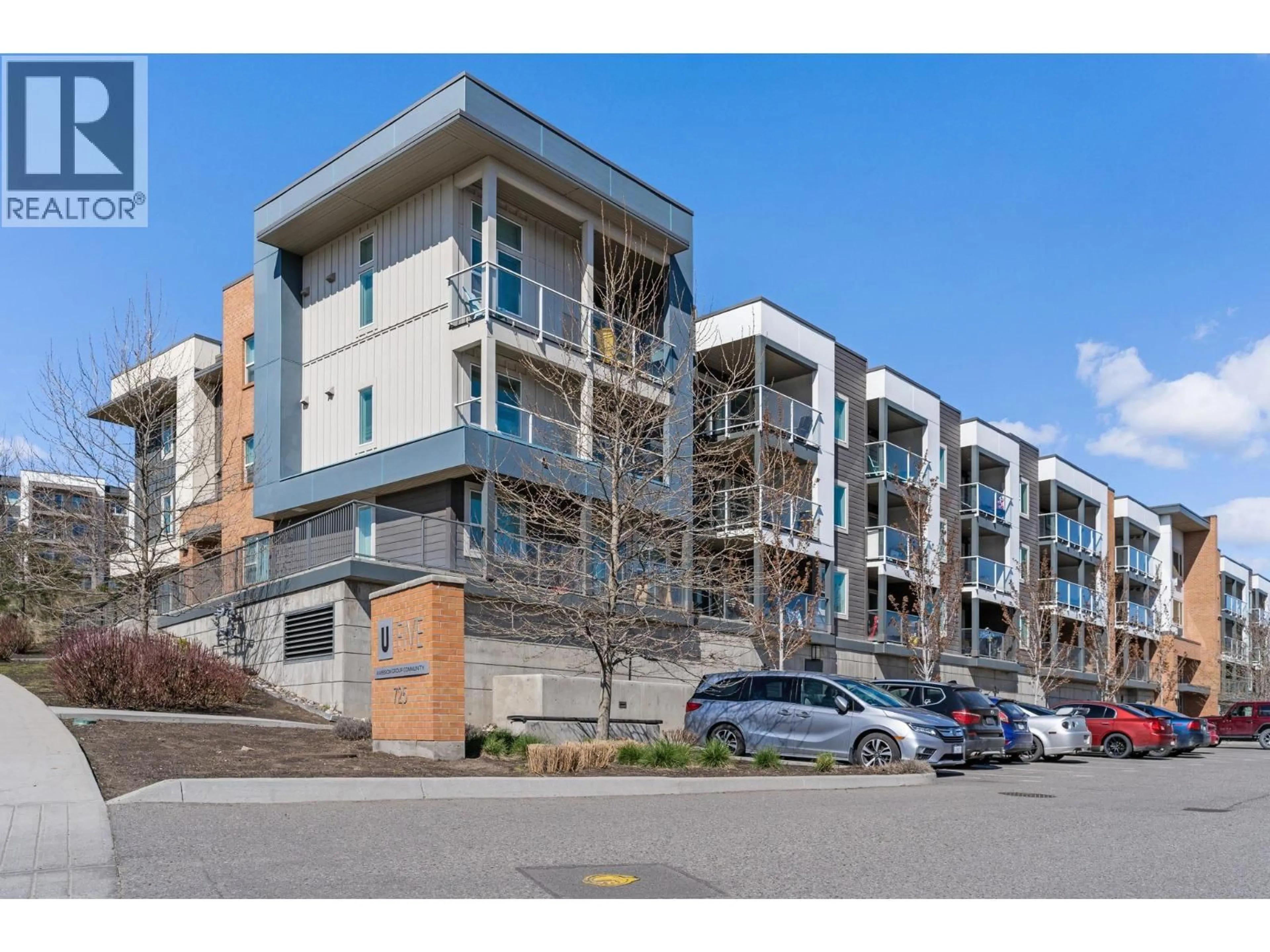 A pic from outside/outdoor area/front of a property/back of a property/a pic from drone, street for 128 - 725 ACADEMY WAY, Kelowna British Columbia V1V0B4