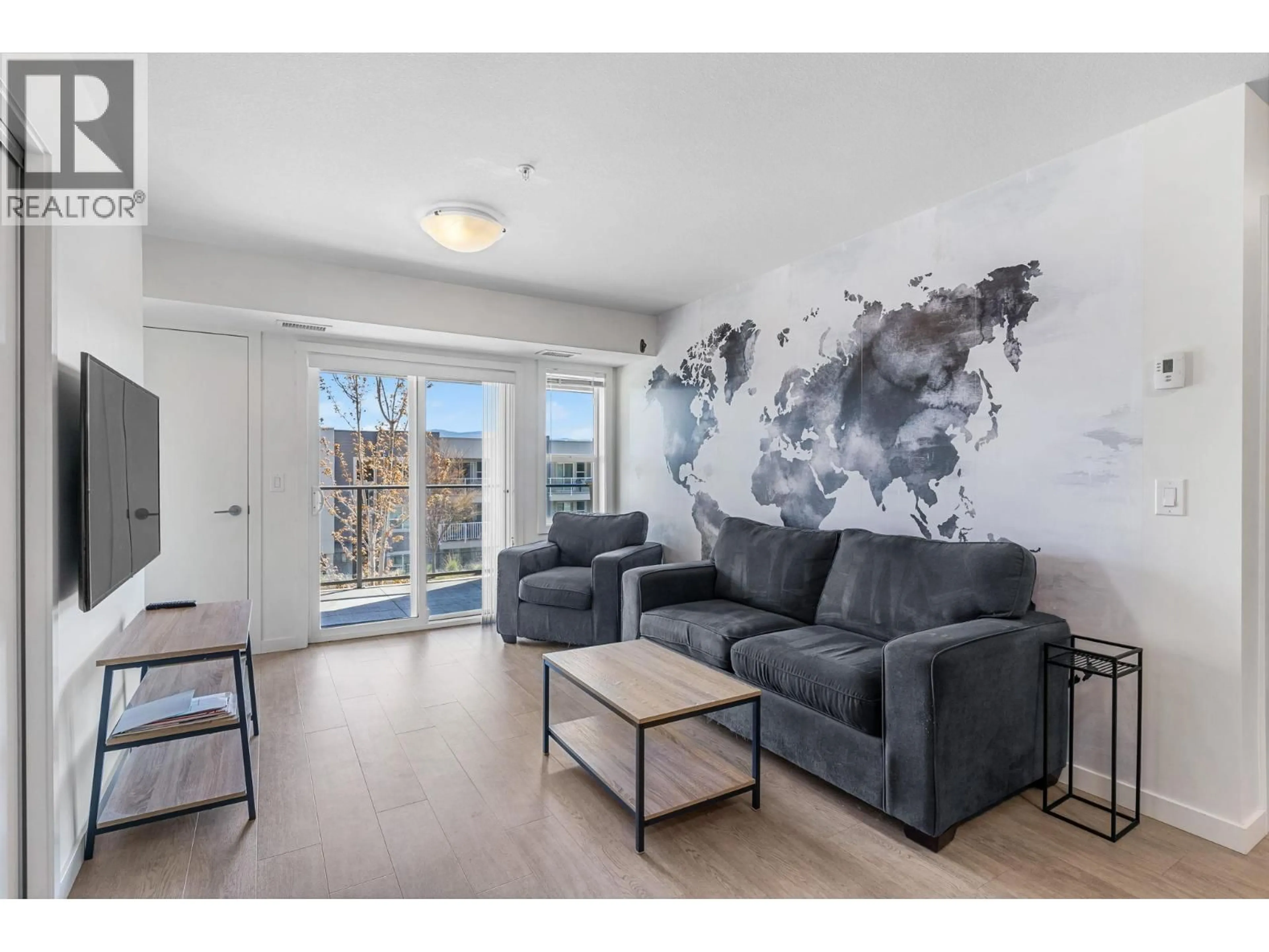 Living room with furniture, unknown for 128 - 725 ACADEMY WAY, Kelowna British Columbia V1V0B4