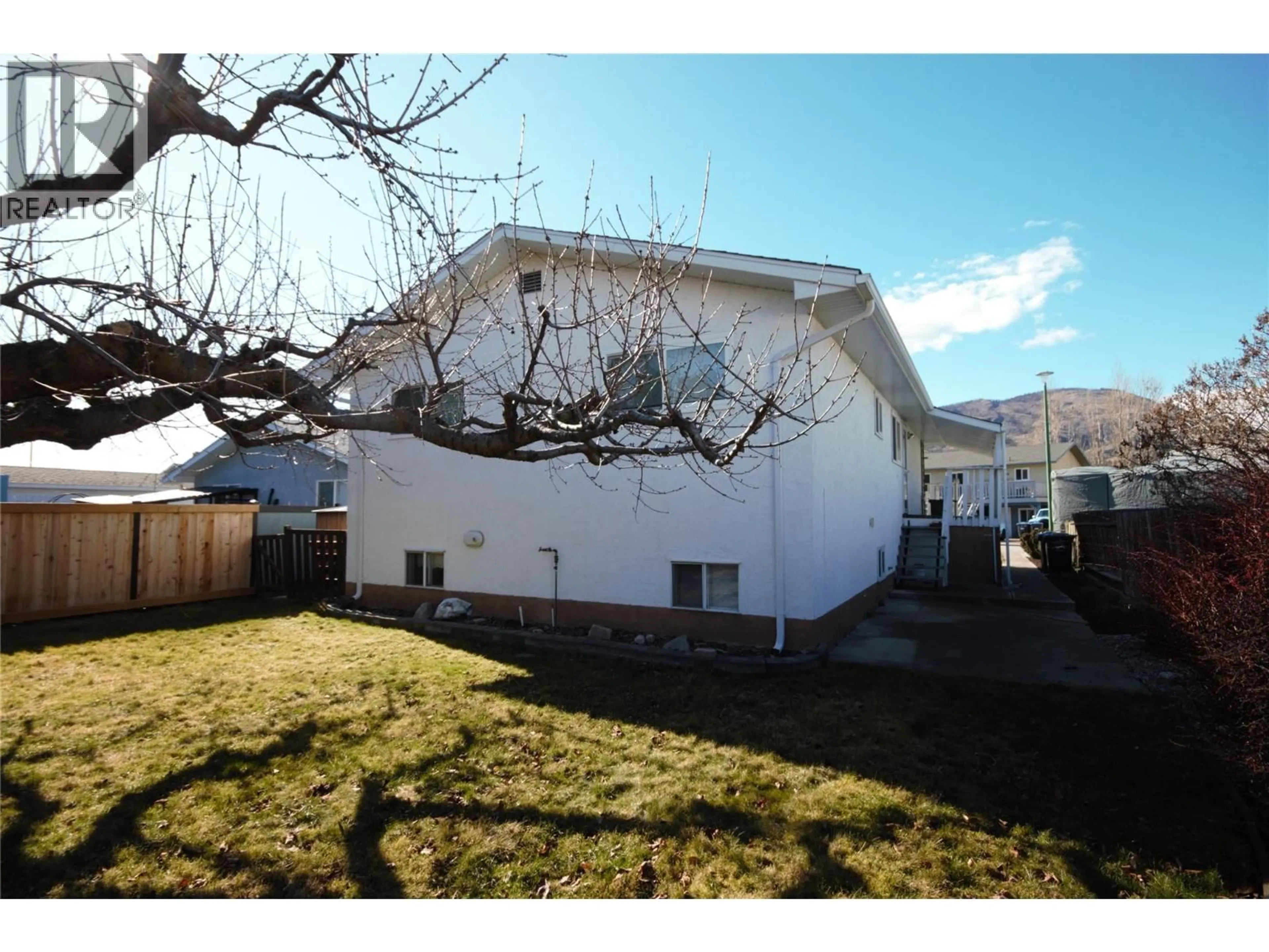 A pic from outside/outdoor area/front of a property/back of a property/a pic from drone, street for 145 BLAIRMORE CRESCENT, Penticton British Columbia V2A7E2