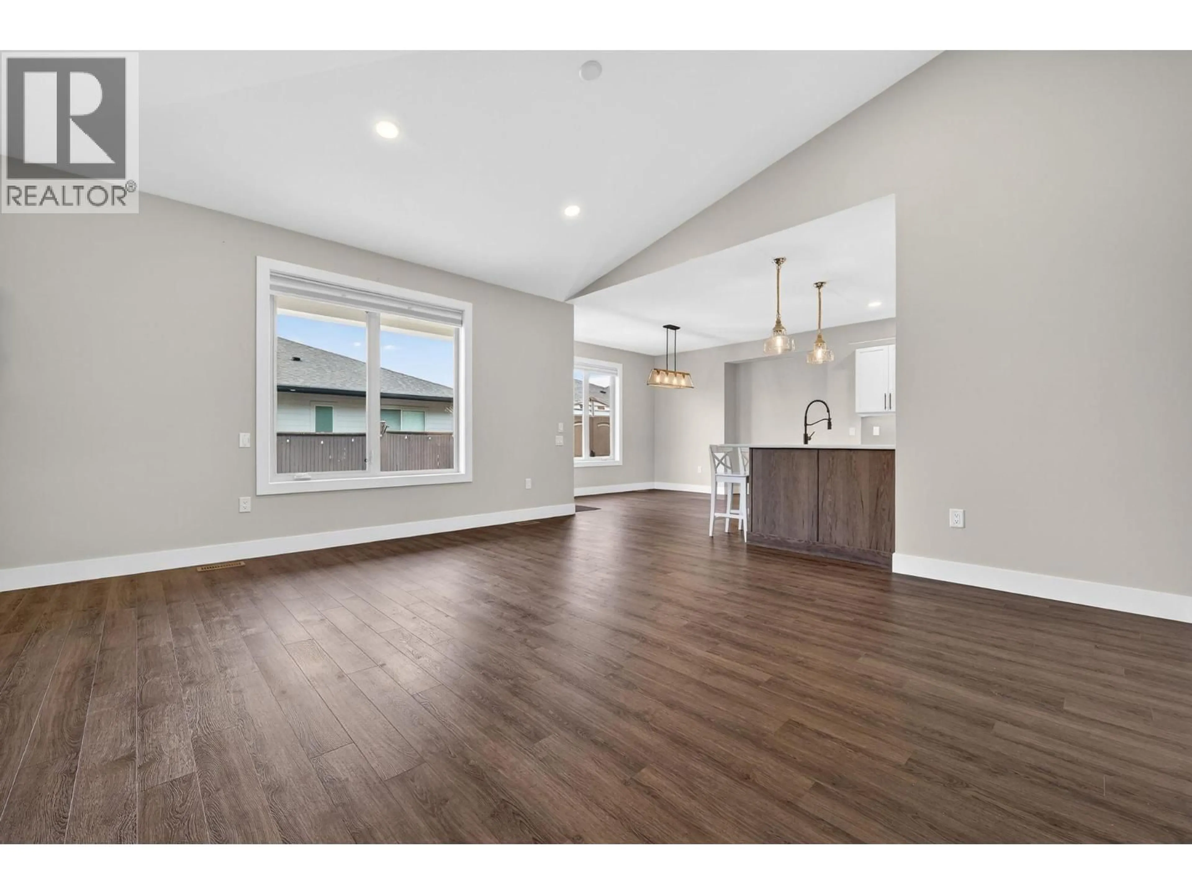 Open concept kitchen, wood/laminate floor for 2312 NORDSTROM AVENUE, Armstrong British Columbia V0E1B8