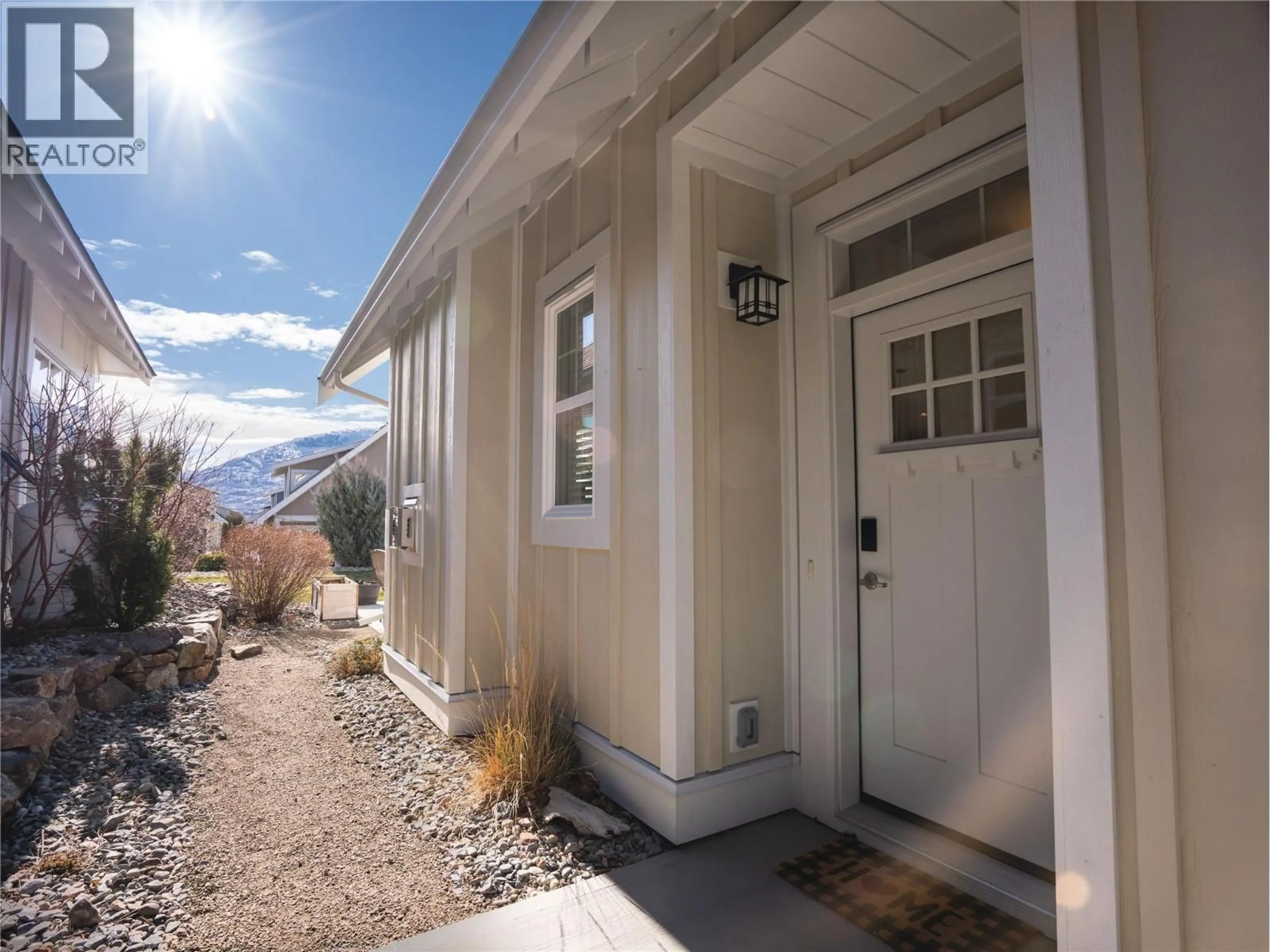 Home with vinyl exterior material, street for 1 - 2450 RADIO TOWER ROAD, Oliver British Columbia V0H1T1