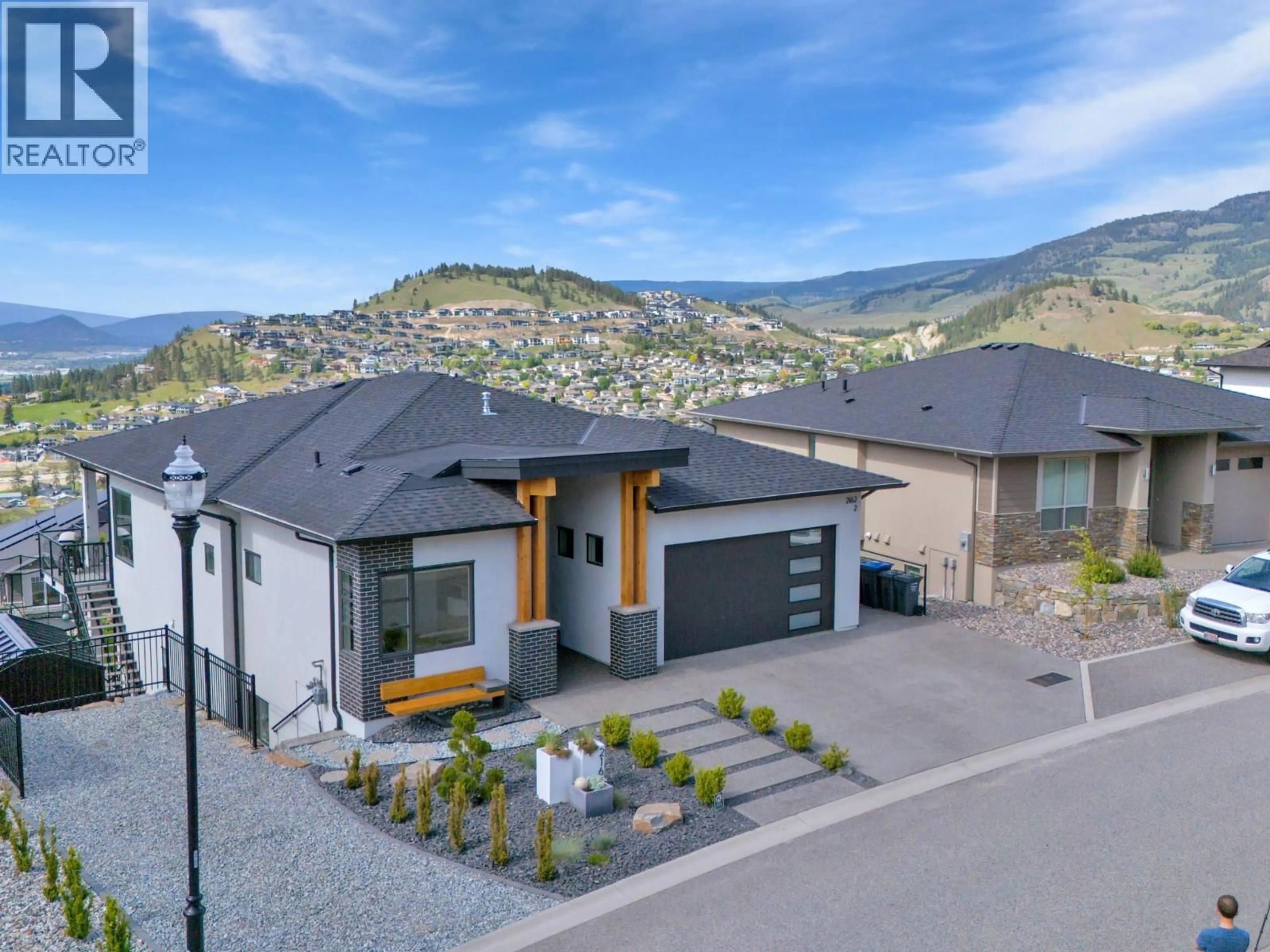 A pic from outside/outdoor area/front of a property/back of a property/a pic from drone, mountain view for 2162 TRAMONTO COURT, Kelowna British Columbia V1P1V1