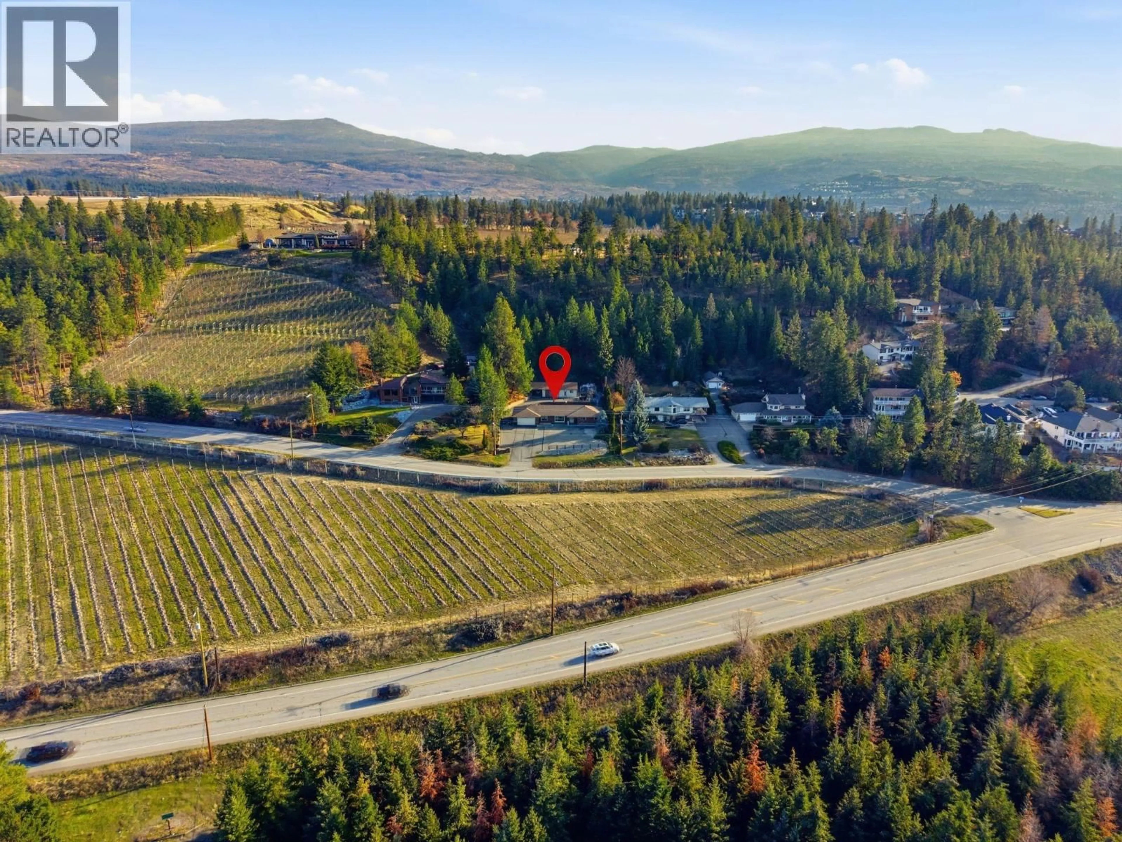 A pic from outside/outdoor area/front of a property/back of a property/a pic from drone, mountain view for 1099 DEHART ROAD, Kelowna British Columbia V1W4N2