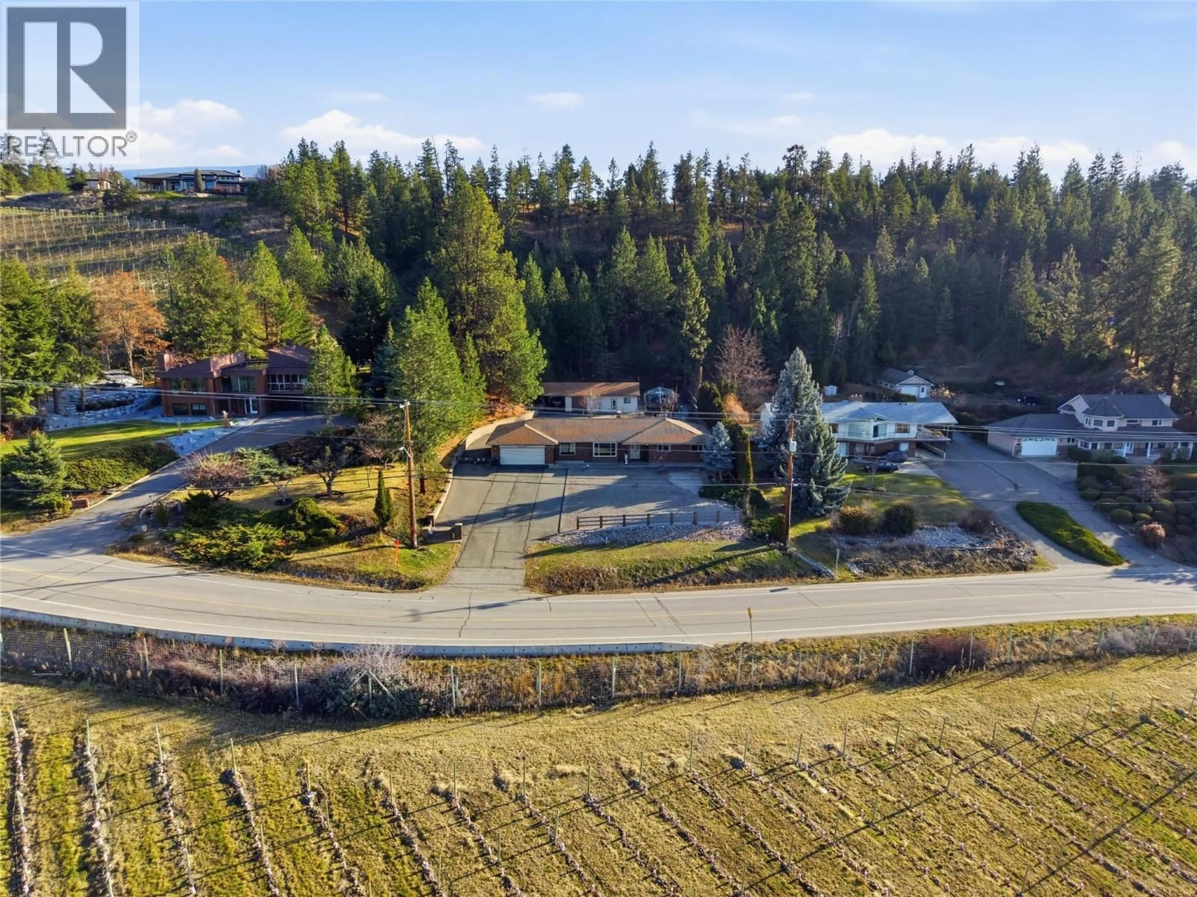 A pic from outside/outdoor area/front of a property/back of a property/a pic from drone, mountain view for 1099 DEHART ROAD, Kelowna British Columbia V1W4N2