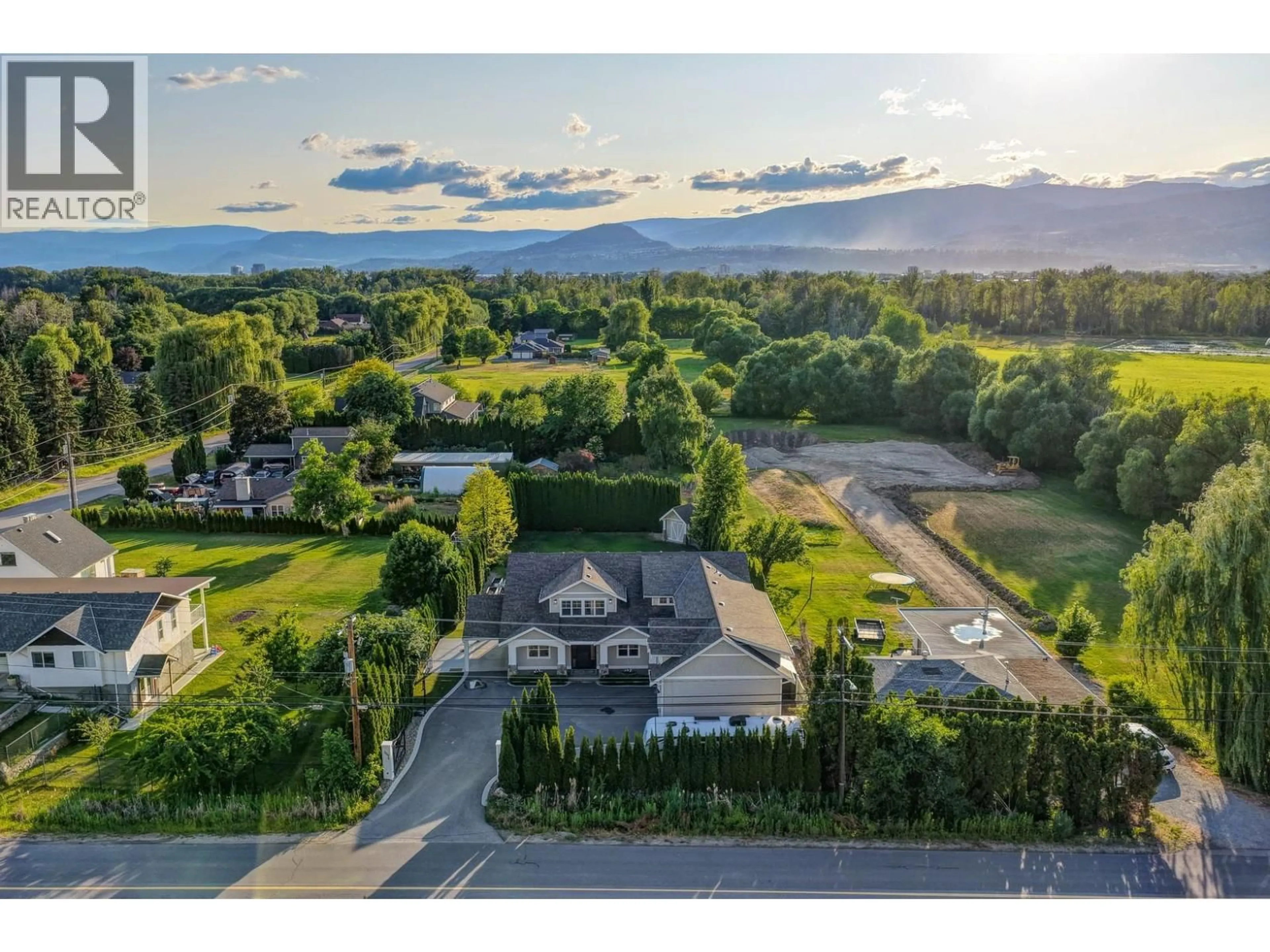 A pic from outside/outdoor area/front of a property/back of a property/a pic from drone, mountain view for 3558 SPIERS ROAD, Kelowna British Columbia V1W4A8