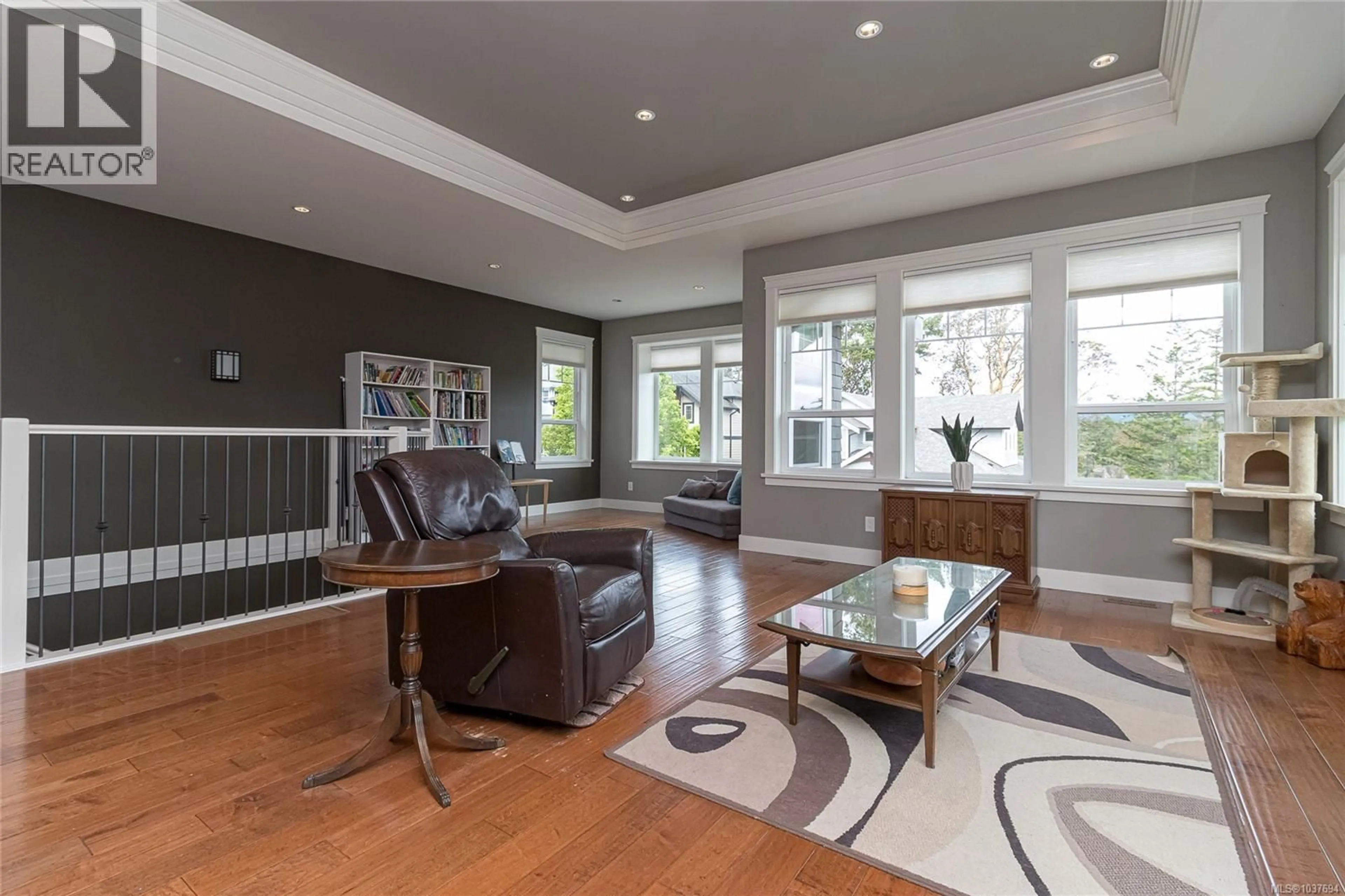 Living room with furniture, wood/laminate floor for 3657 COLEMAN PLACE, Colwood British Columbia V9C0H2