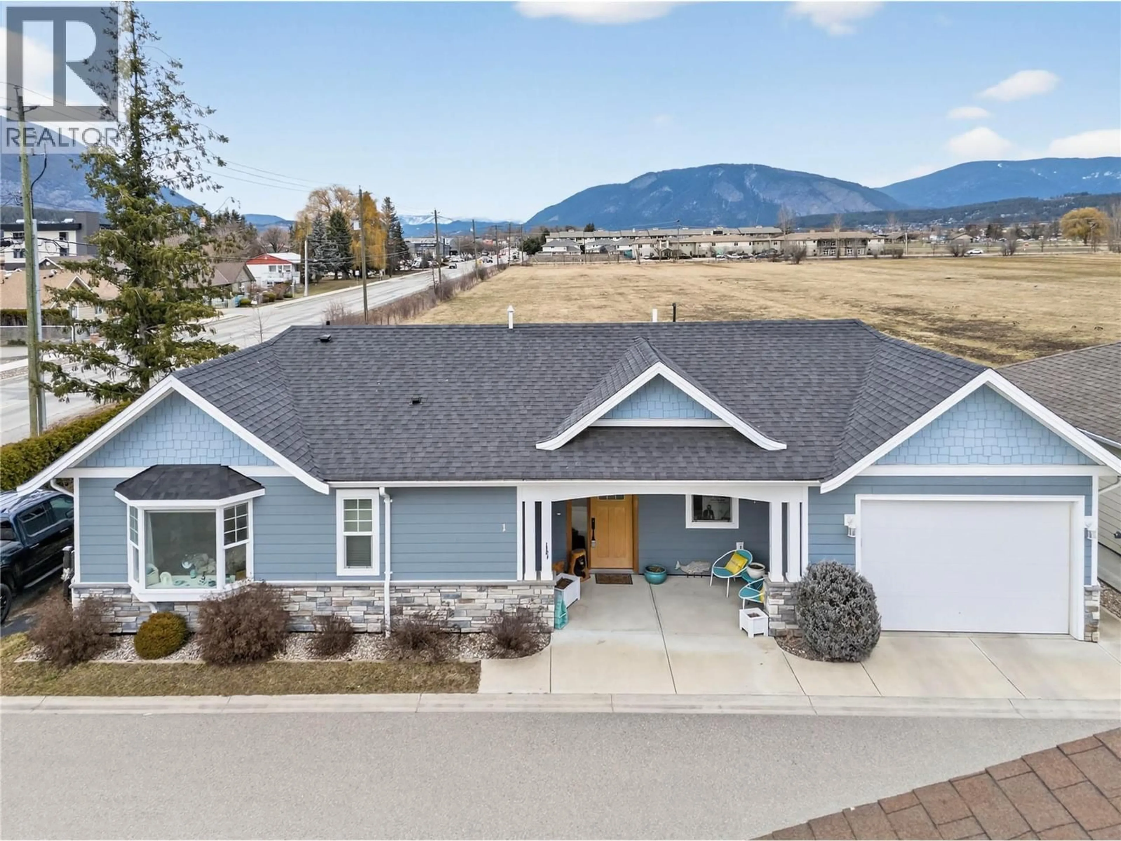A pic from outside/outdoor area/front of a property/back of a property/a pic from drone, mountain view for 1 - 1330 10 STREET SOUTHWEST, Salmon Arm British Columbia V1E0E4