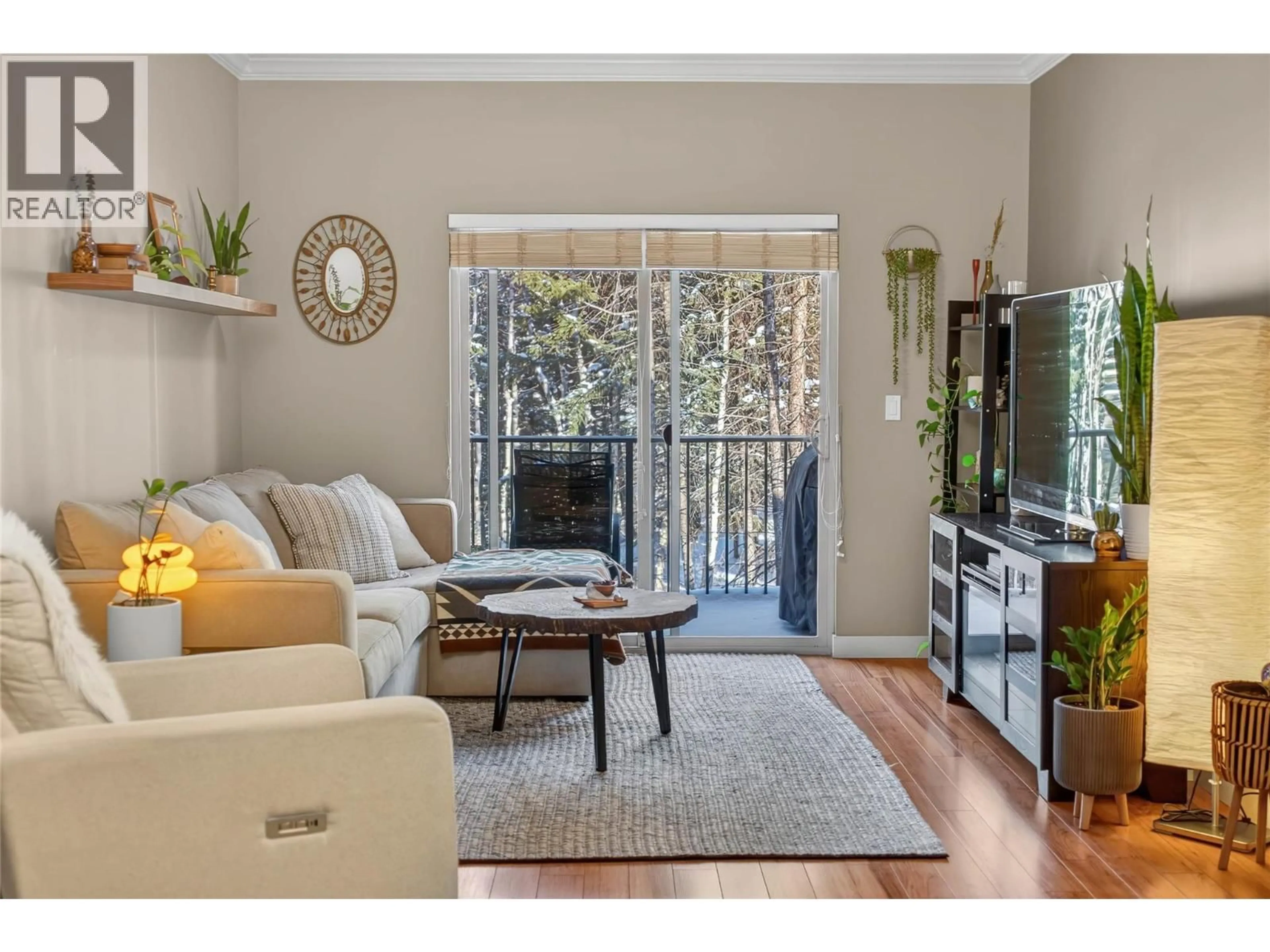 Living room with furniture, wood/laminate floor for 205 - 1330 WHITEWOOD CRESCENT, Sparwood British Columbia V0B2G2