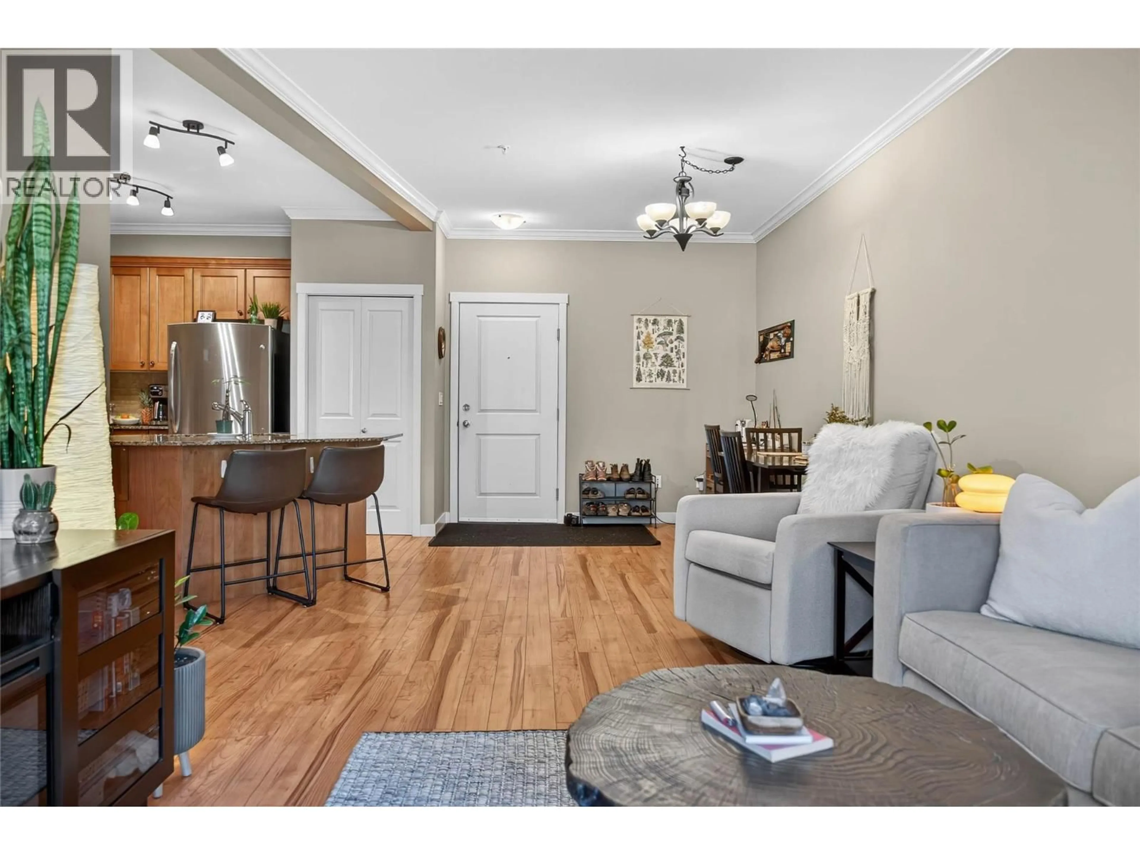 Living room with furniture, wood/laminate floor for 205 - 1330 WHITEWOOD CRESCENT, Sparwood British Columbia V0B2G2