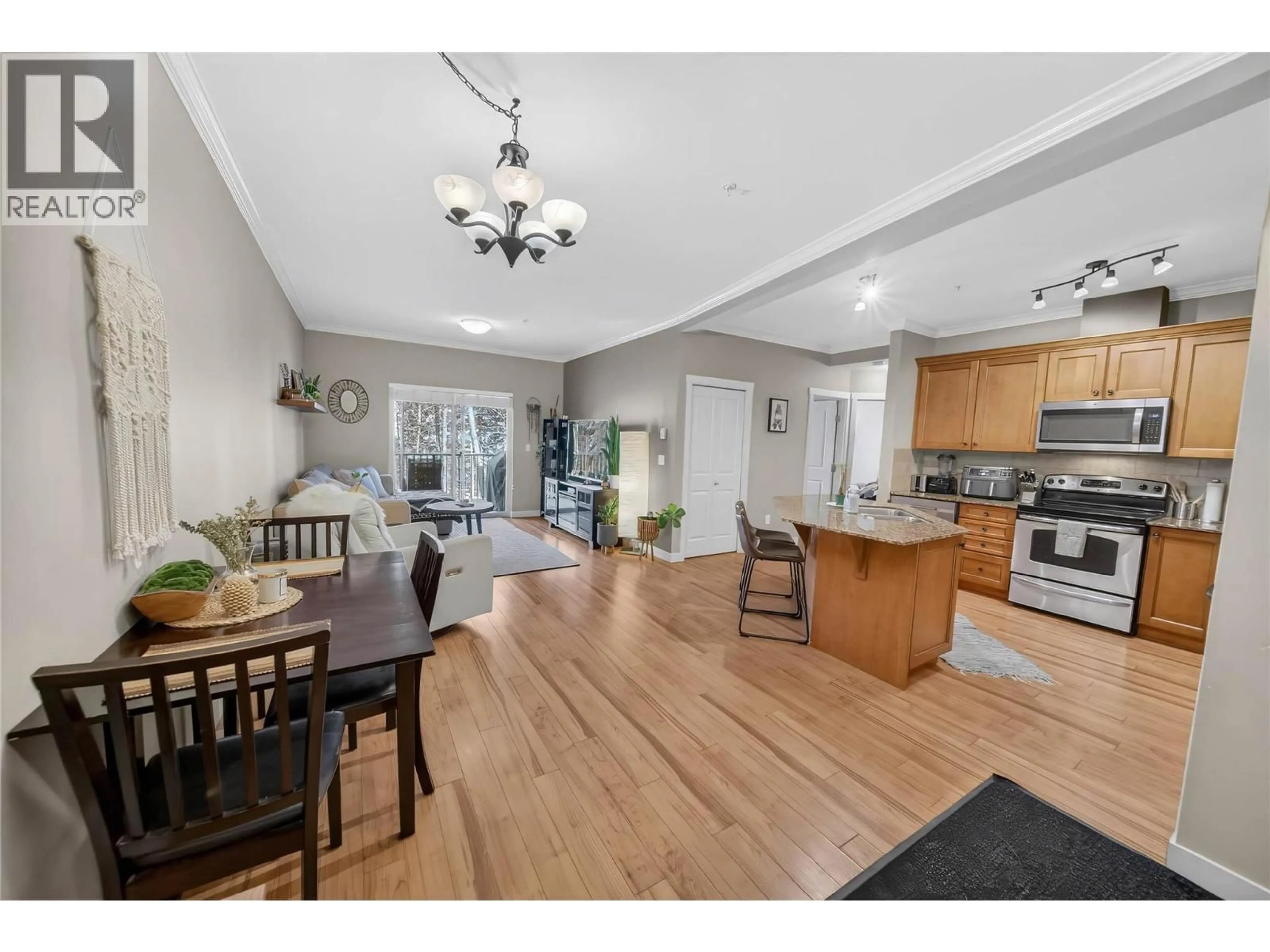 Open concept kitchen, wood/laminate floor for 205 - 1330 WHITEWOOD CRESCENT, Sparwood British Columbia V0B2G2